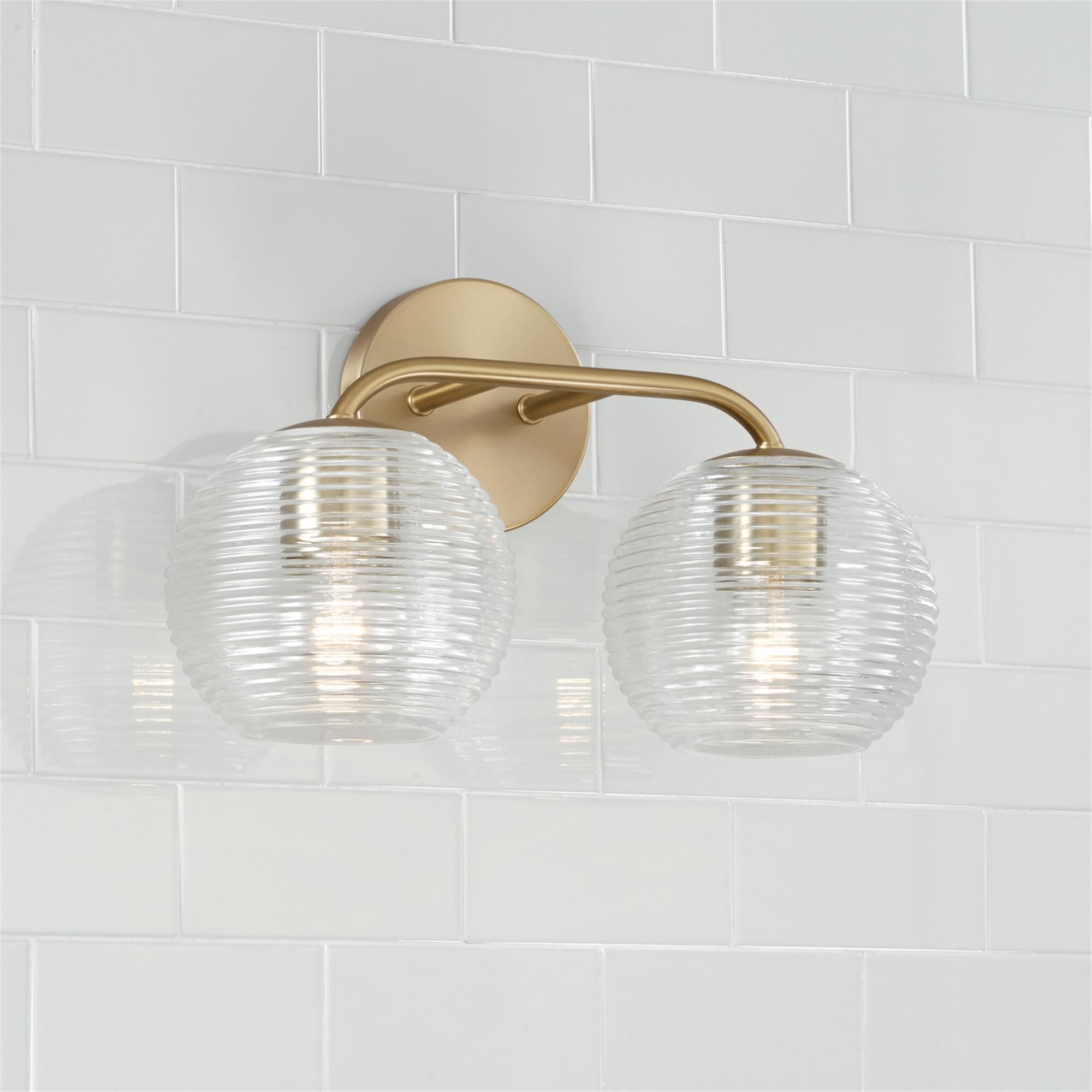 Shown in Matte Brass finish and Clear Ribbed glass