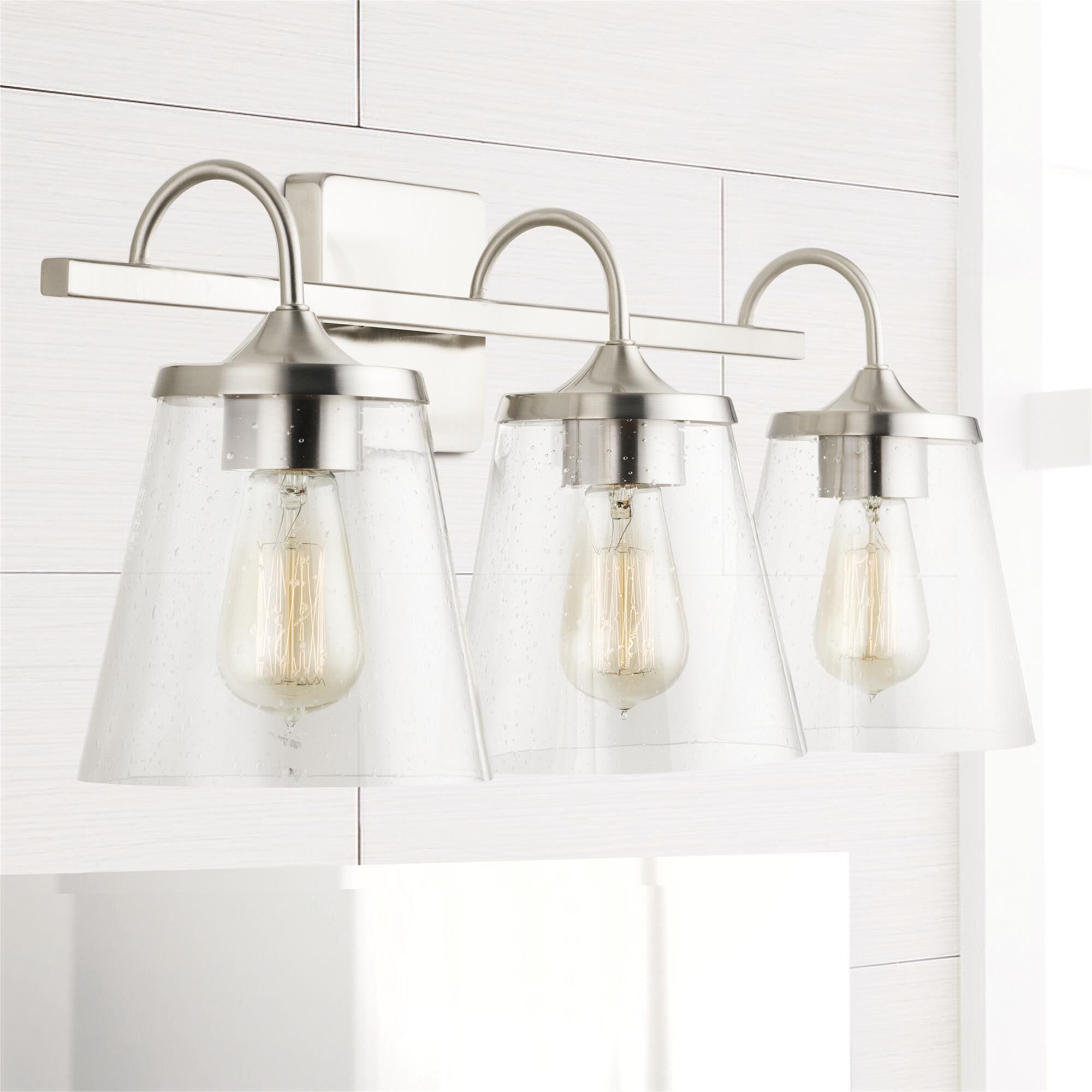 Shown in Brushed Nickel finish and Clear Seeded glass