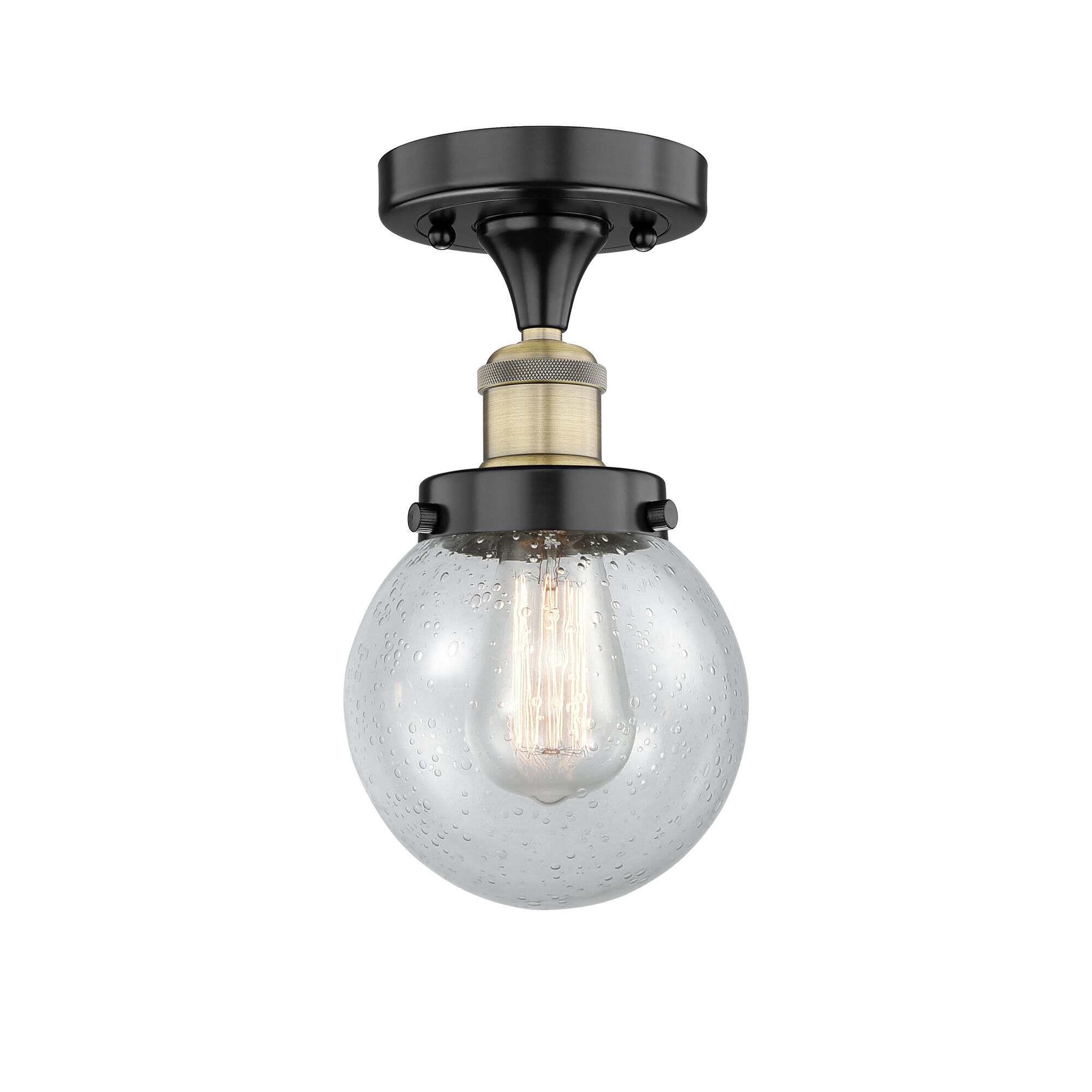 Shown in Black Antique Brass finish and Seedy glass