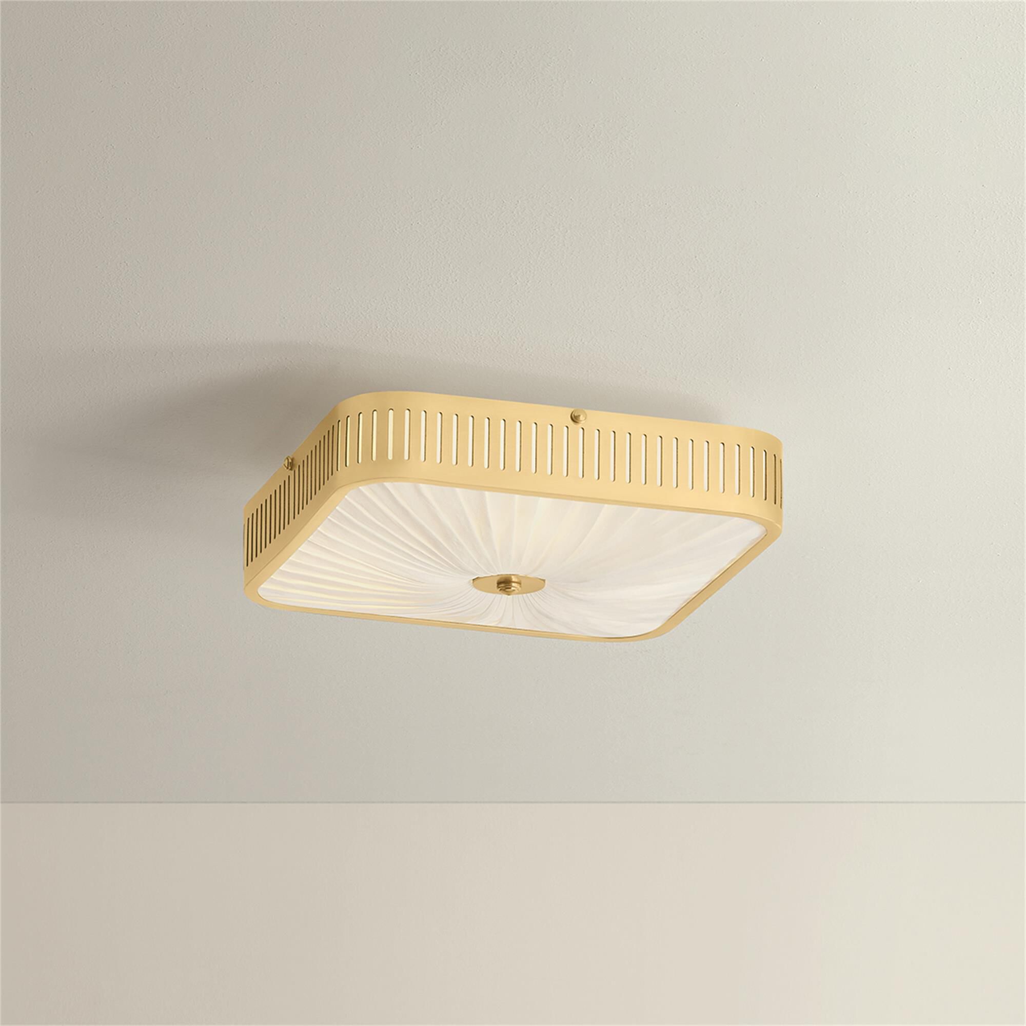 Shown in Aged Brass finish and Ivory Silk shade