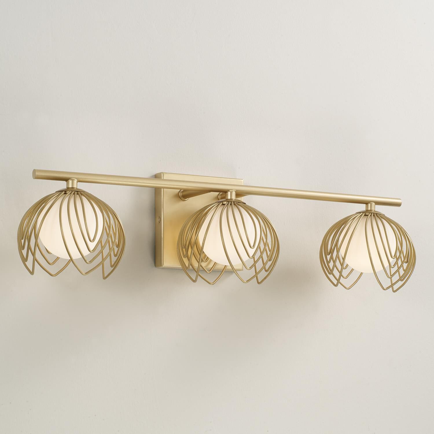 Shown in Buffed Gold finish and Soft White  Globes glass