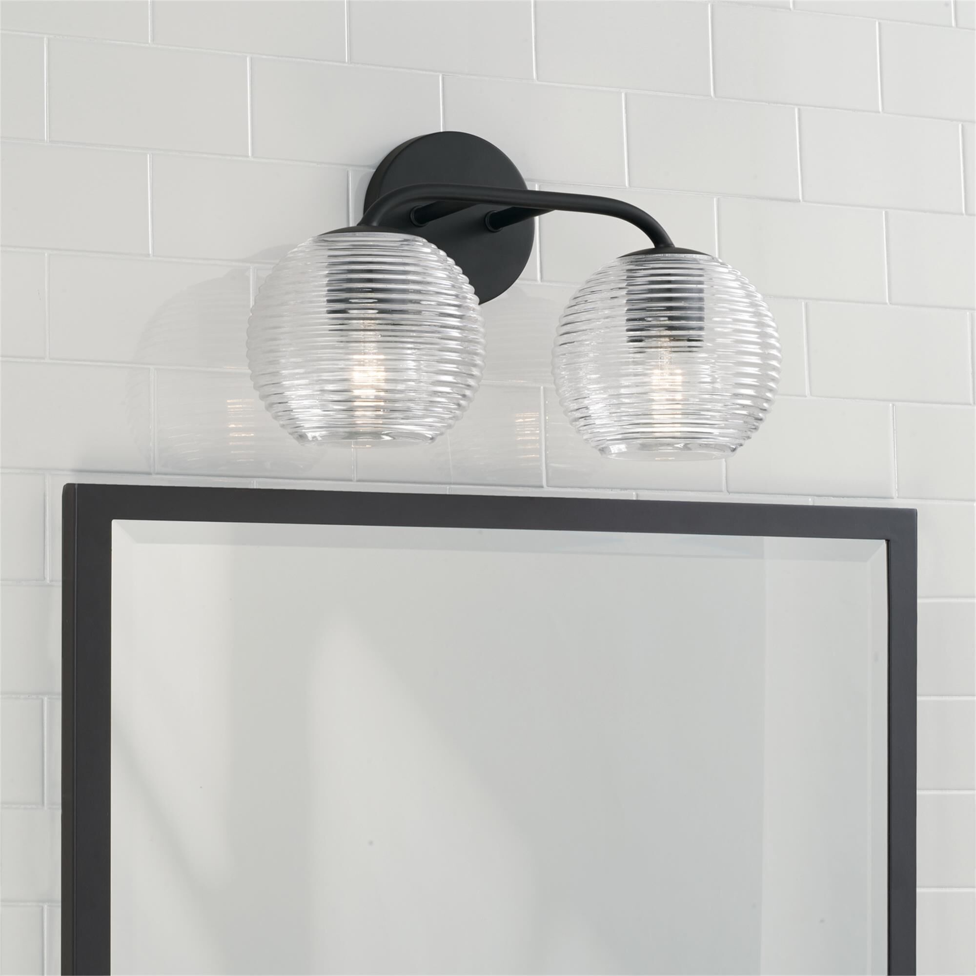 Shown in Matte Black finish and Clear Ribbed glass