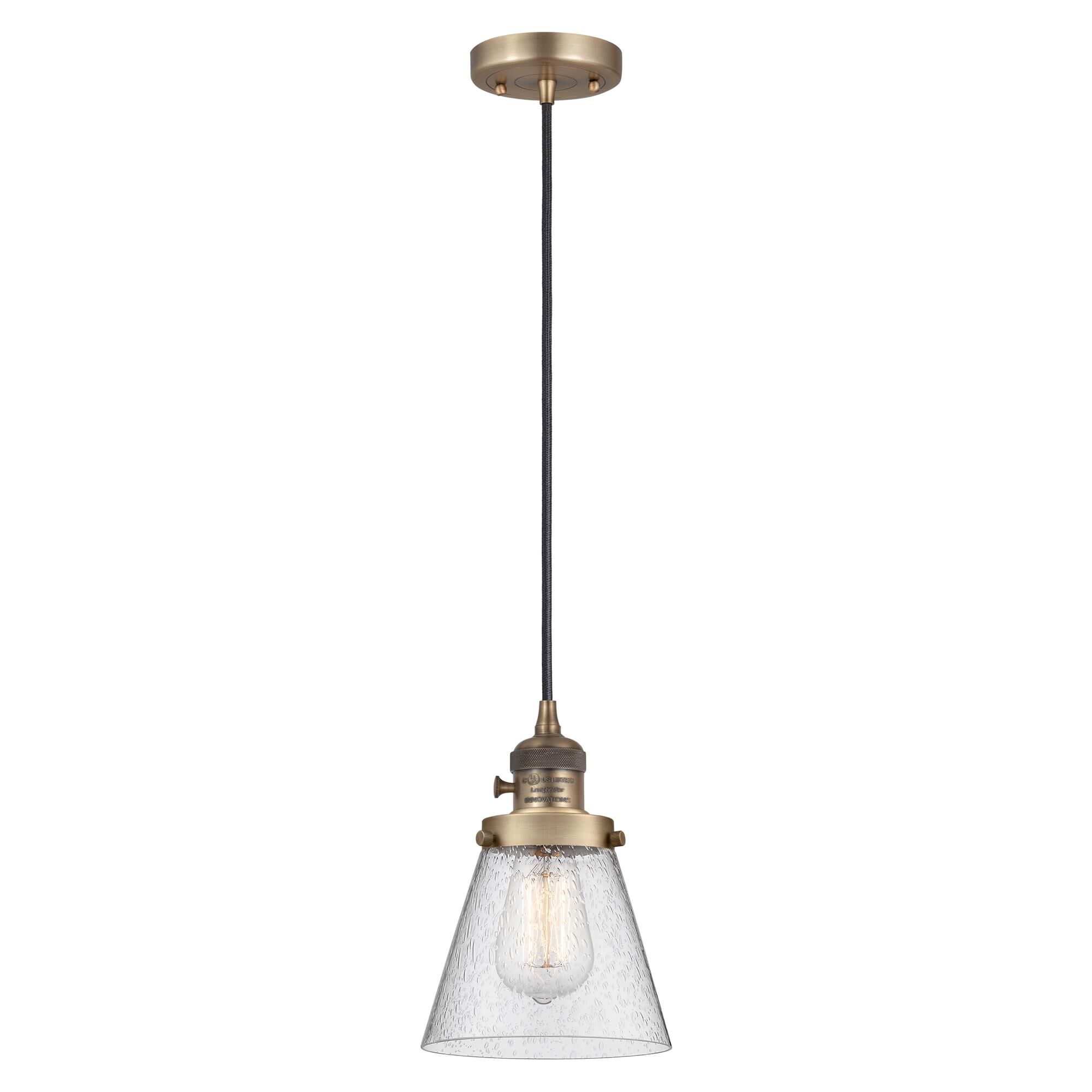 Shown in Brushed Brass finish and Seedy glass