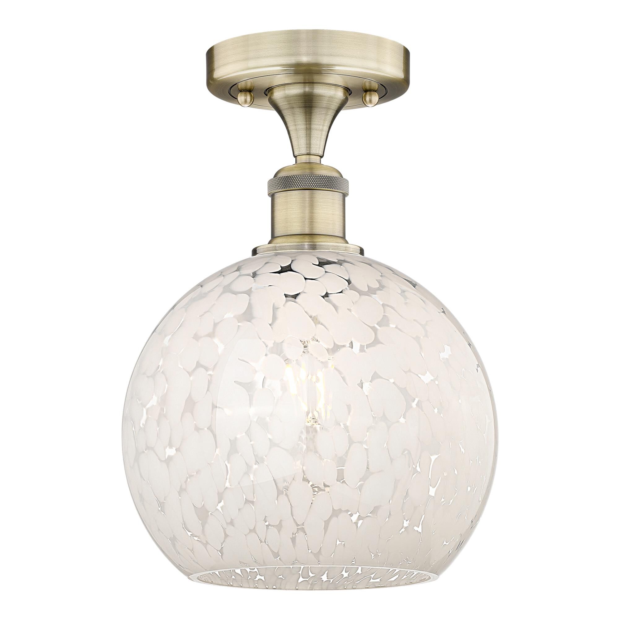 Shown in Antique Brass finish and White Mouchette glass