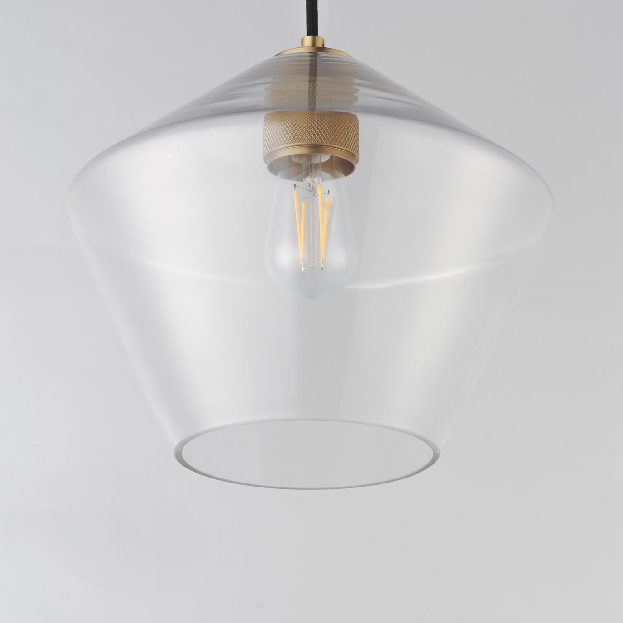 Shown in Natural Aged Brass finish and Clear glass