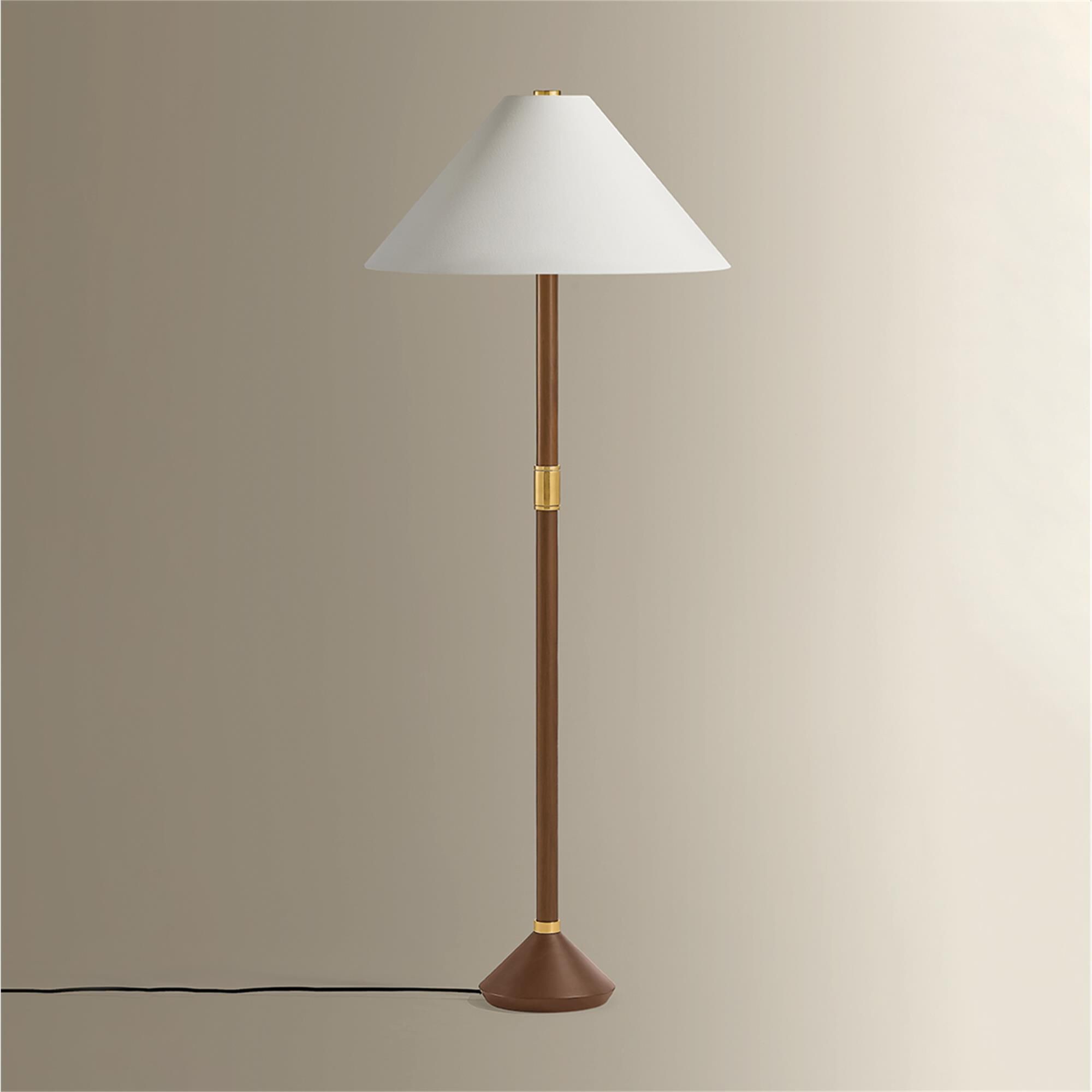 Shown in Aged Brass finish and White Linen shade