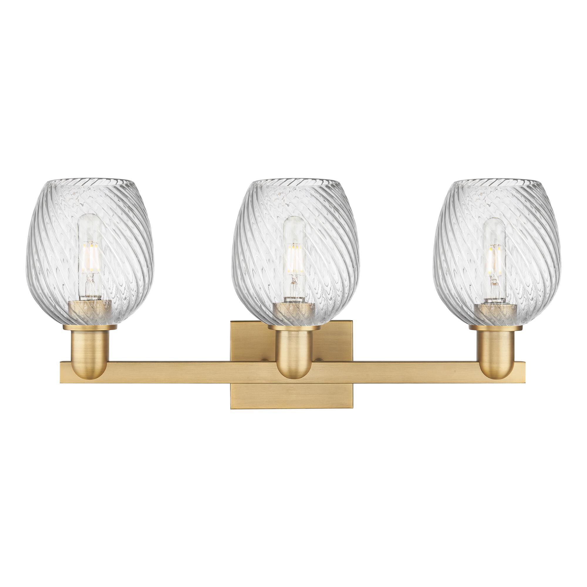Shown in Brushed Brass finish and Clear Spiral Fluted glass