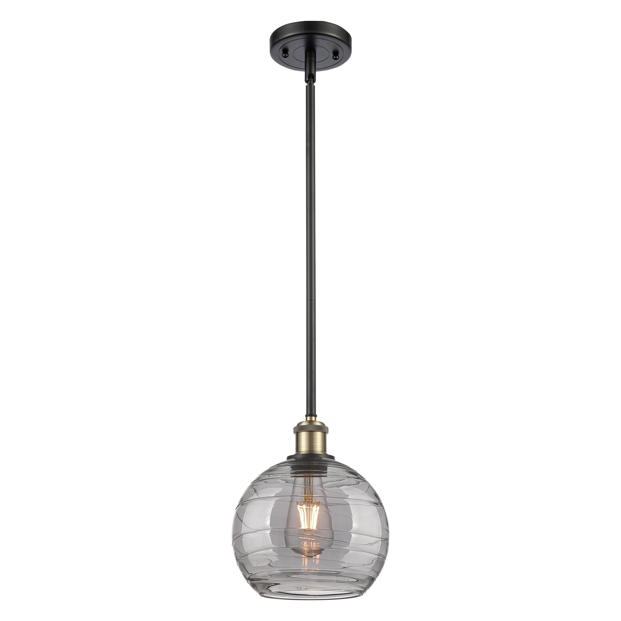 Shown in Black Antique Brass finish and Light Smoke Deco Swirl glass