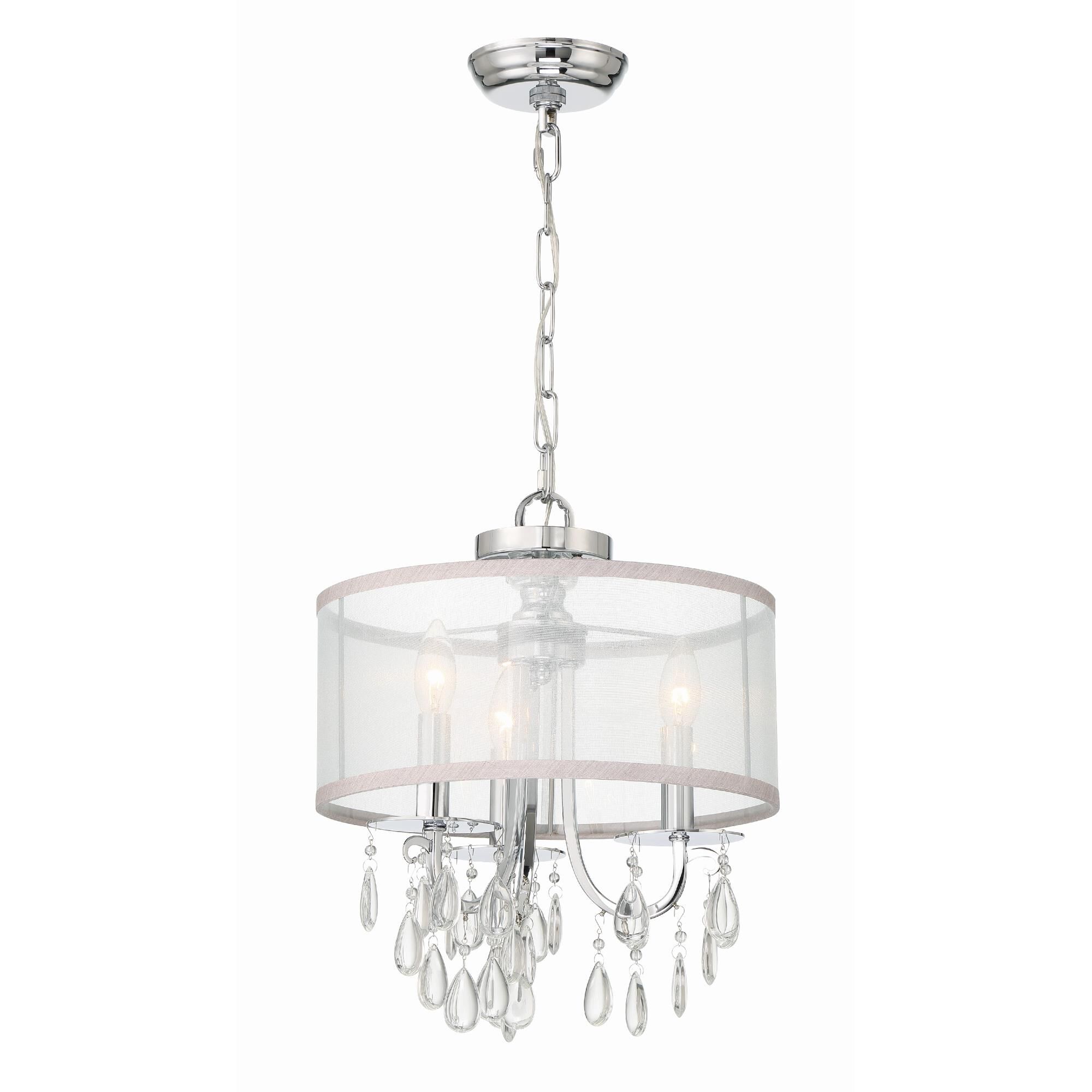 Shown in Polished Chrome finish and Clear Teardrop Almond crystal and Silk glass and Translucent Silver shade