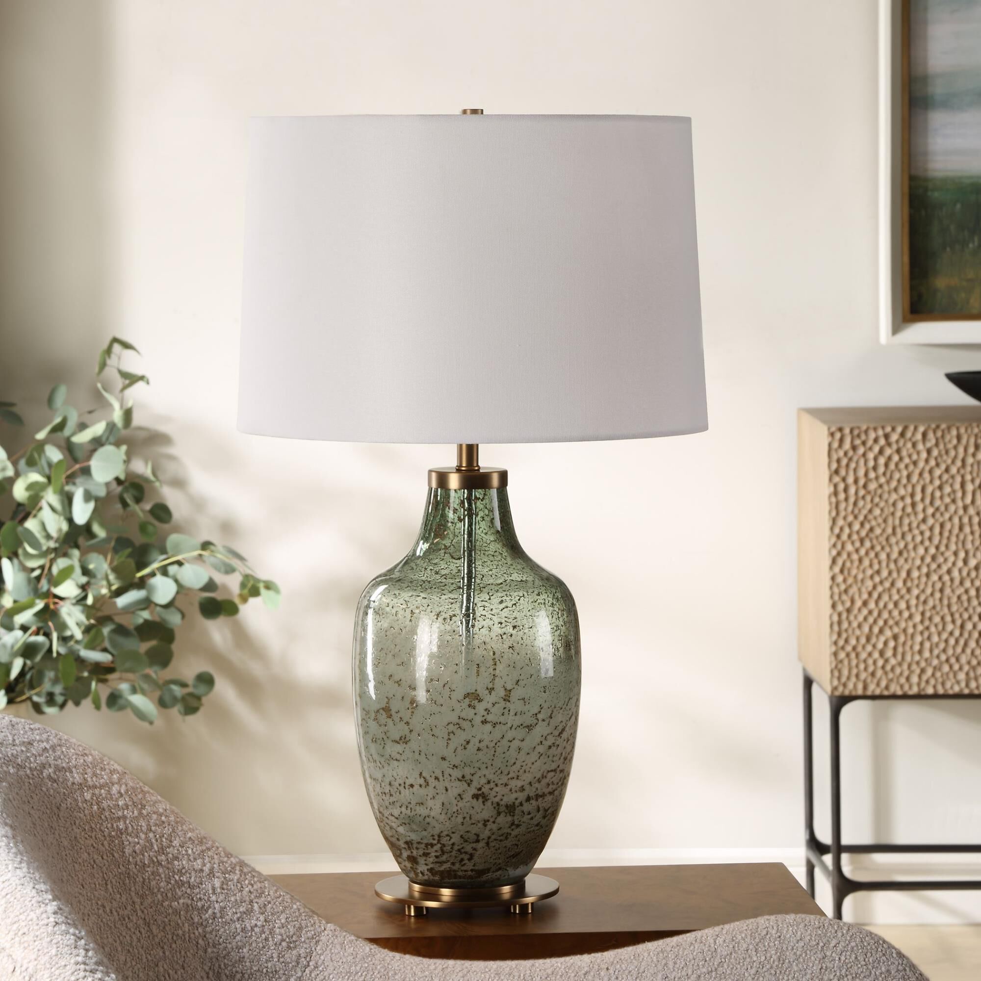 Shown in This Glass Table Lamp Features A Beautiful Blend Of Translucent Olive Green With A Subtle Ivory Wash finish and Round Hardback shade