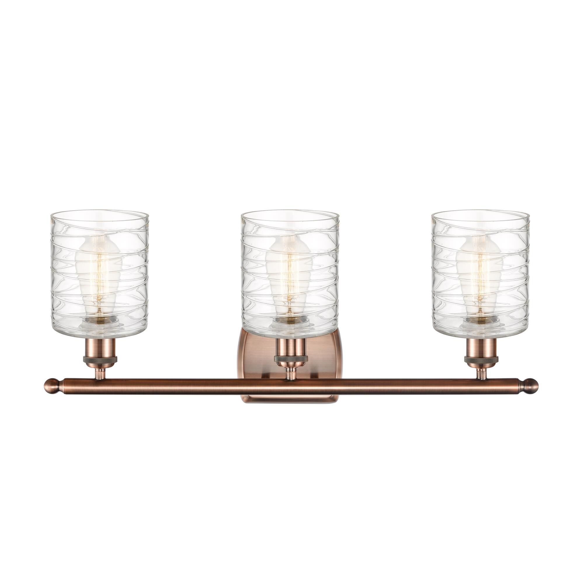 Shown in Antique Copper finish and Deco Swirl glass