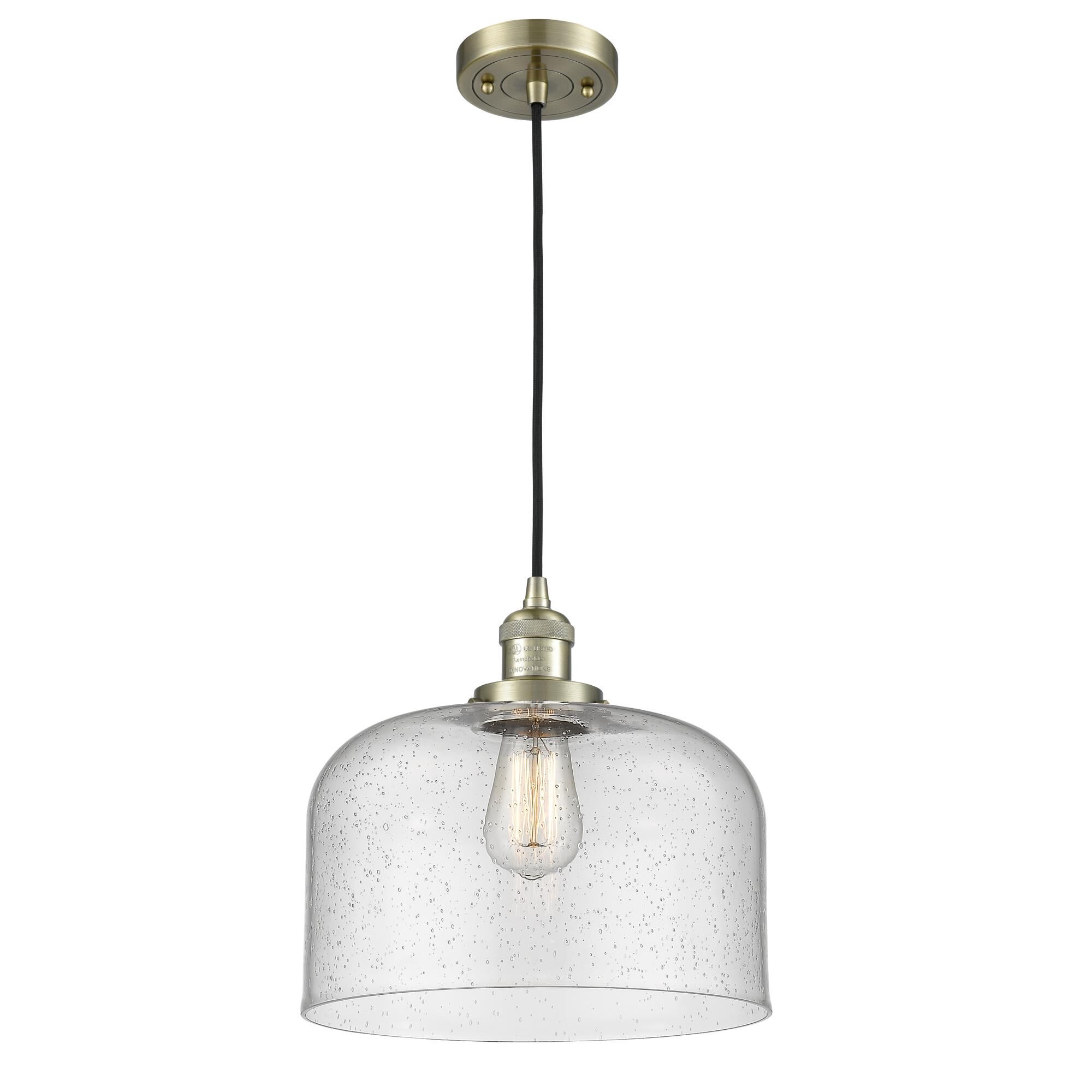 Shown in Antique Brass finish and Seedy glass