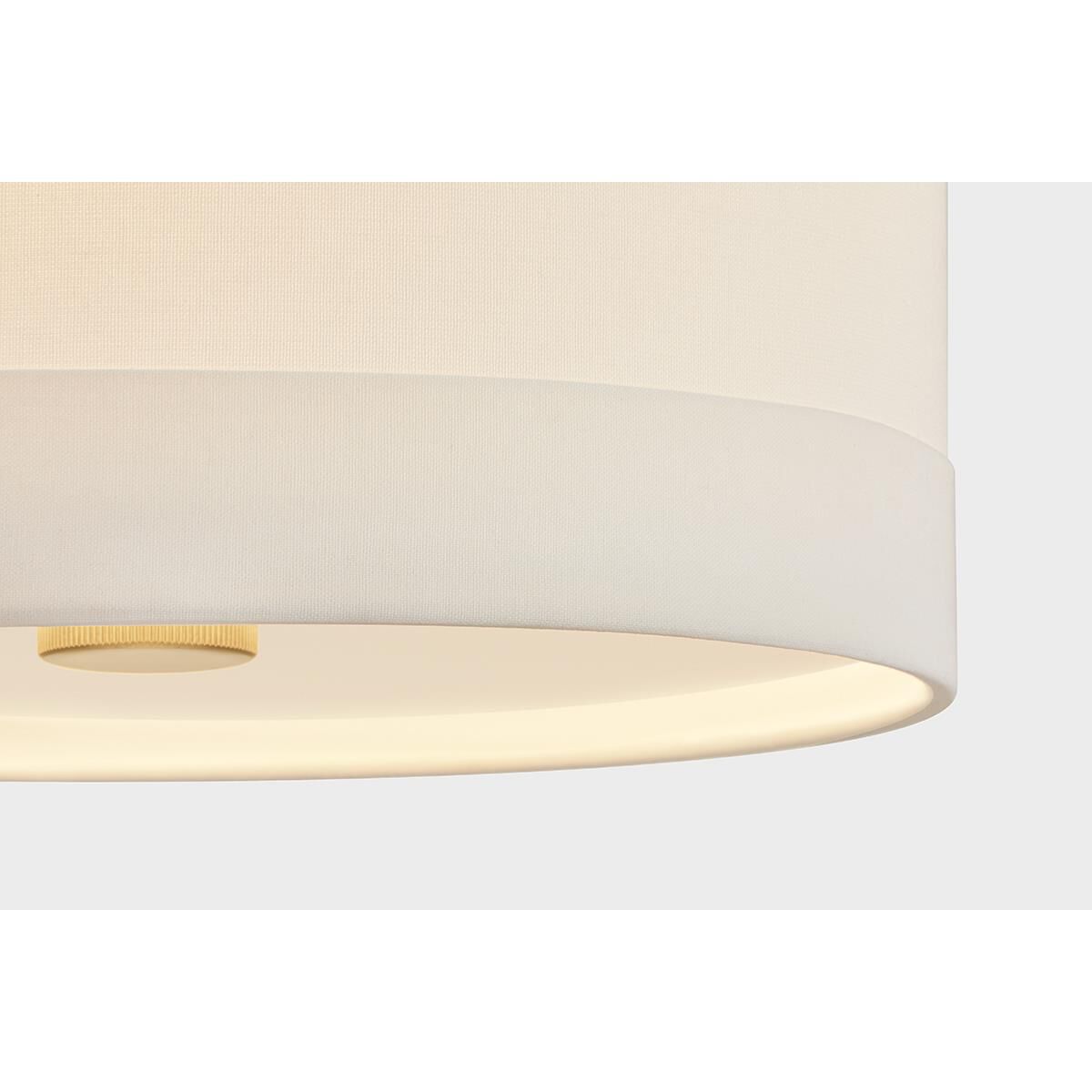 Shown in Aged Brass finish and White Linen shade