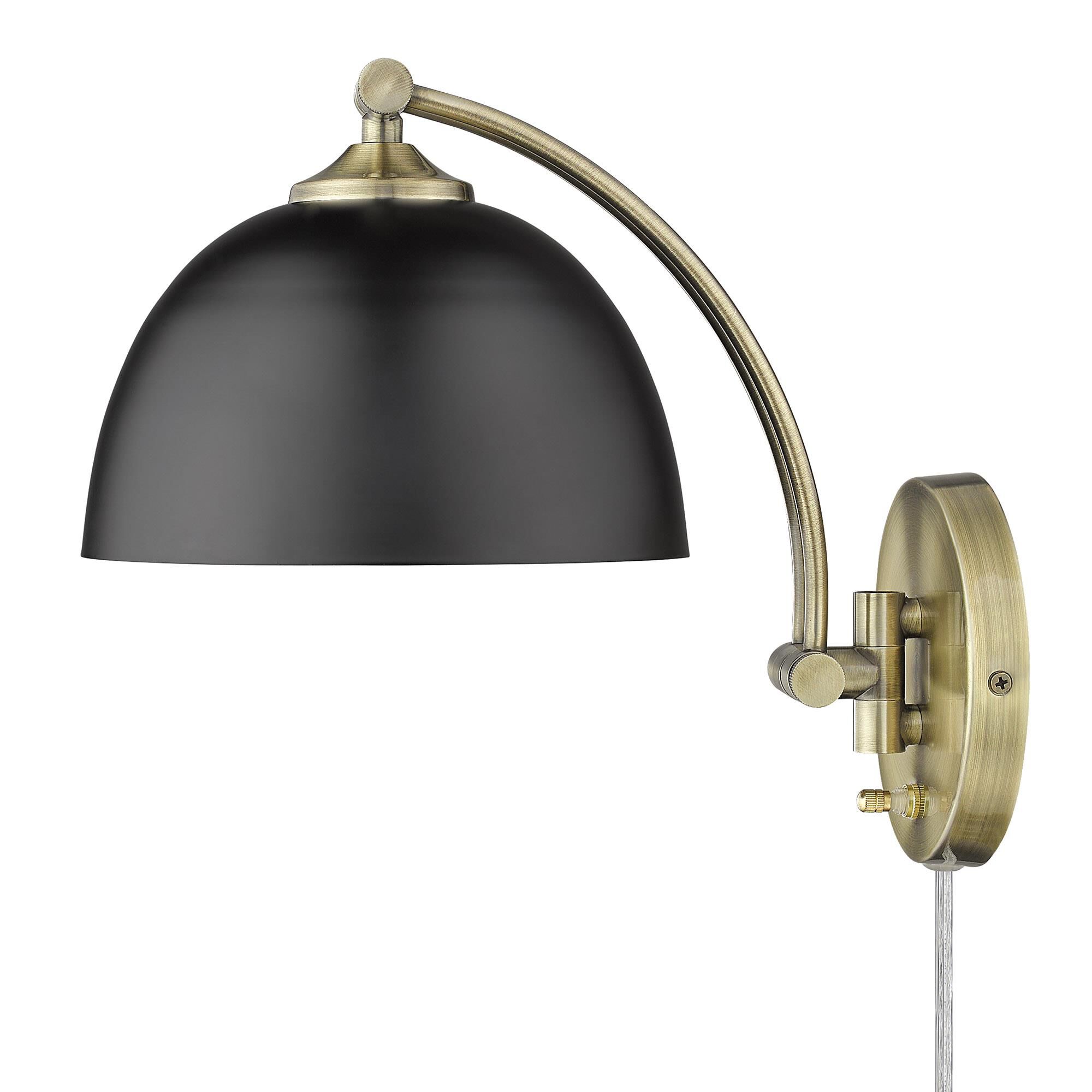 Shown in Aged Brass finish and Matte Black shade