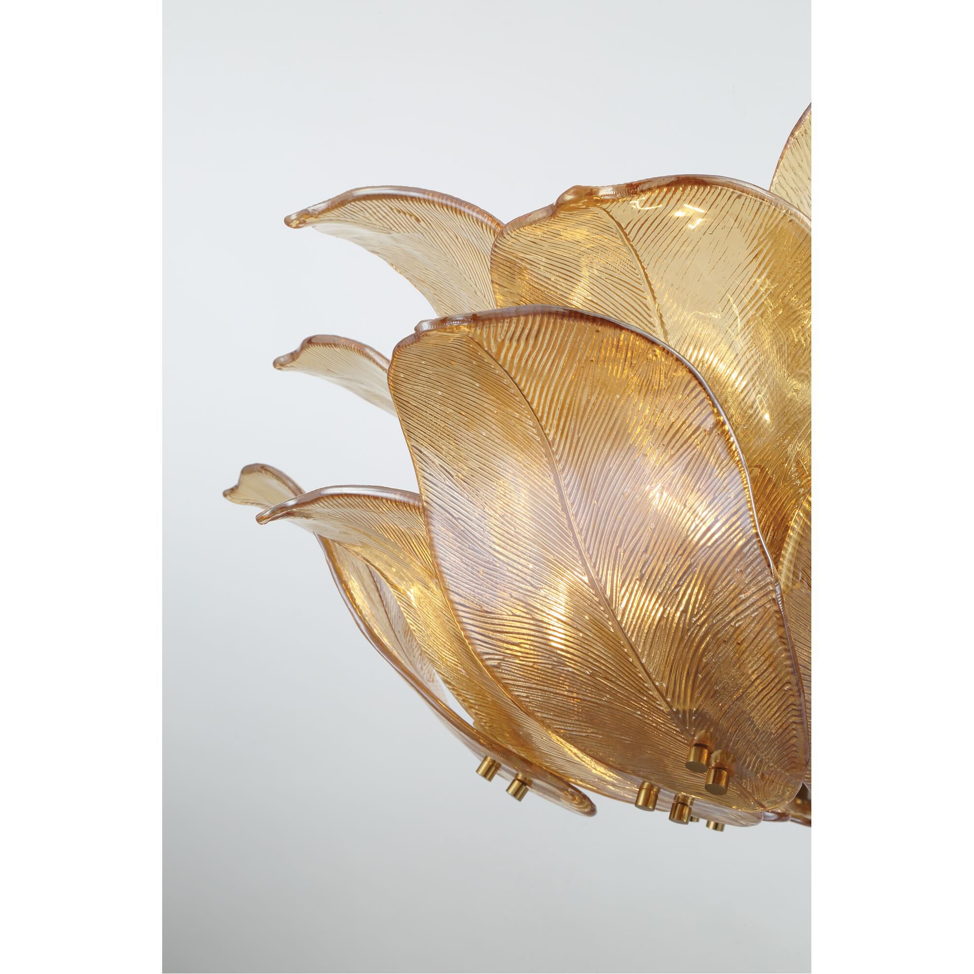 Shown in Legacy Brass finish and Amber Handmade glass