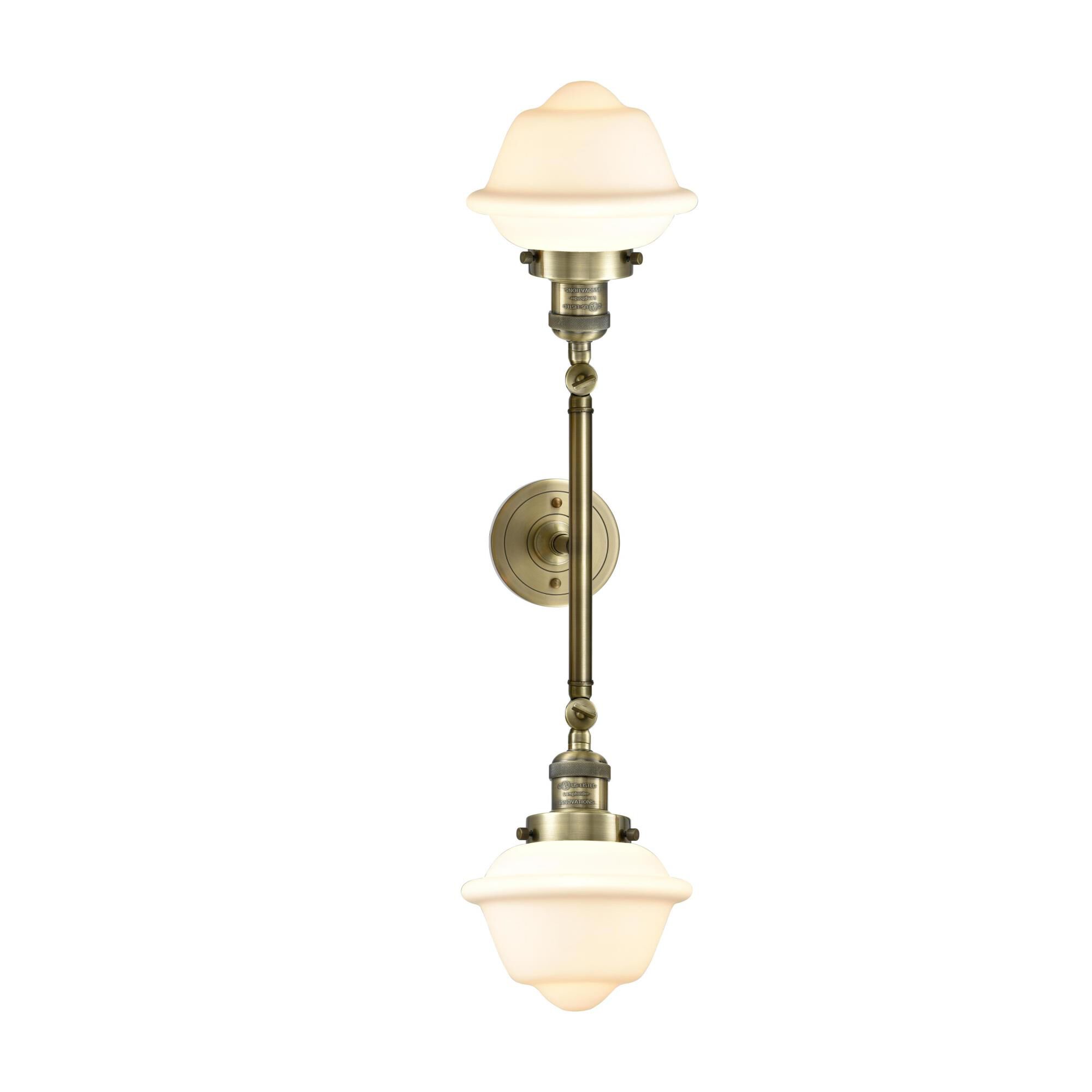 Shown in Antique Brass finish and Matte White Cased glass