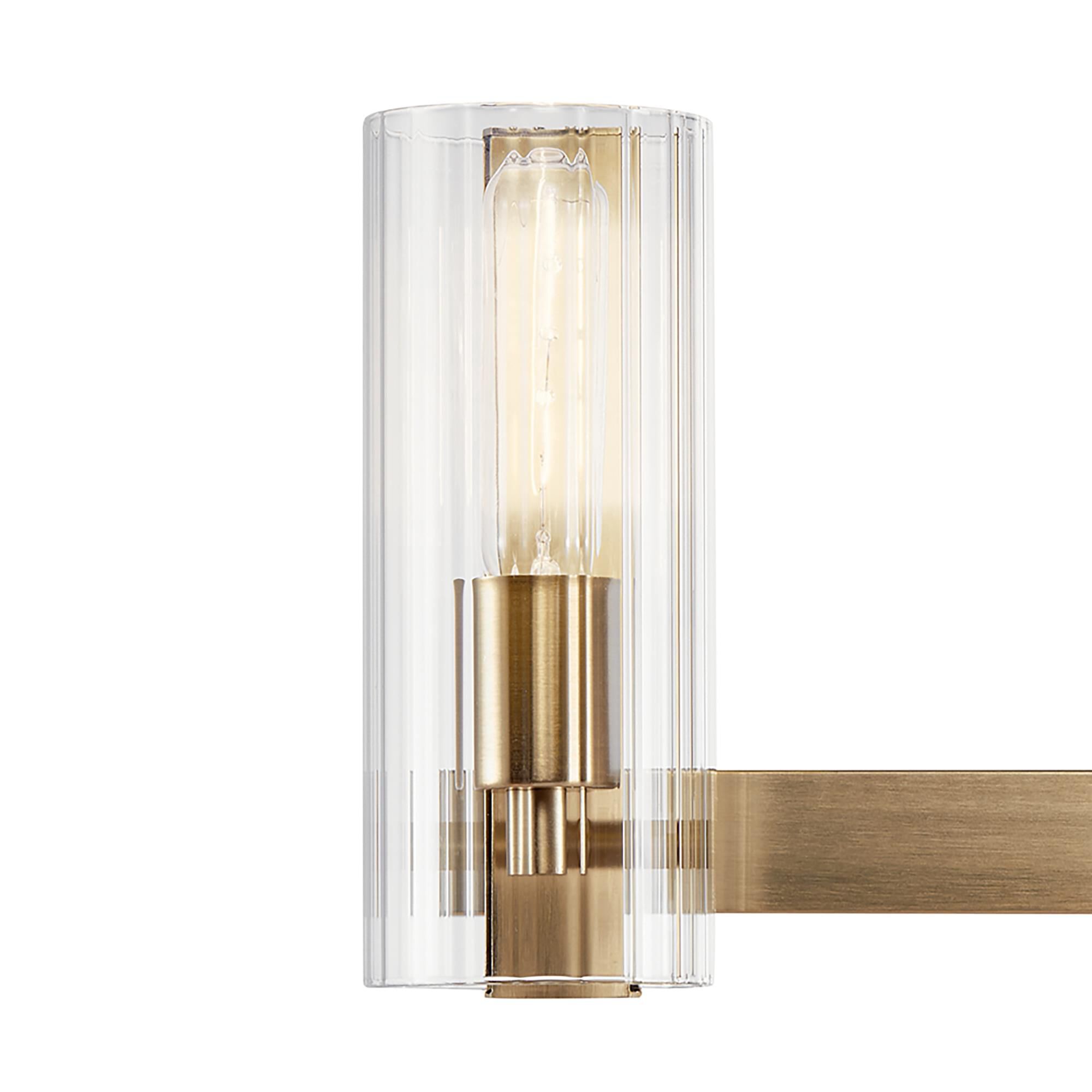 Shown in Champagne Bronze finish and Clear Fluted glass