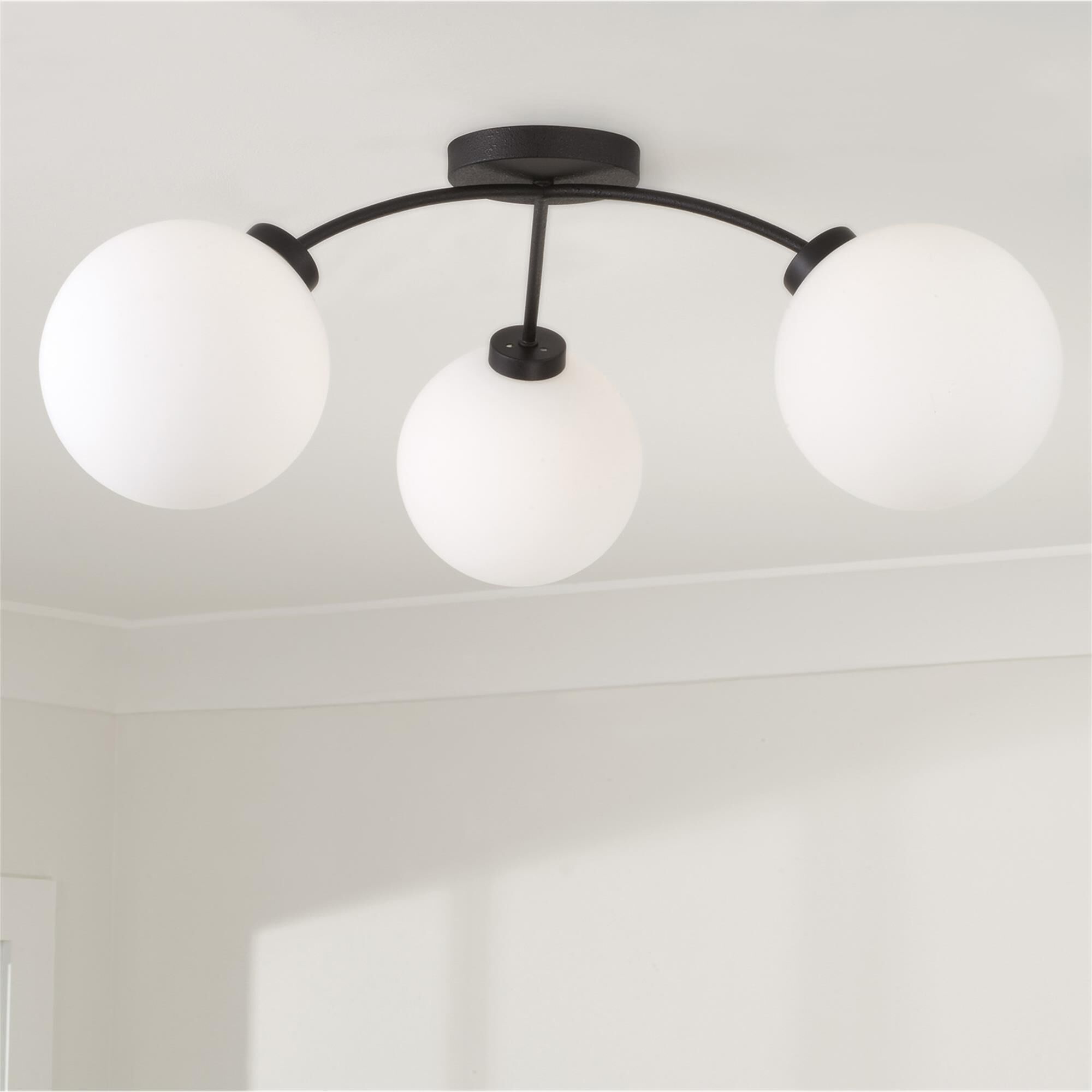 Shown in Black Iron finish and Soft White glass