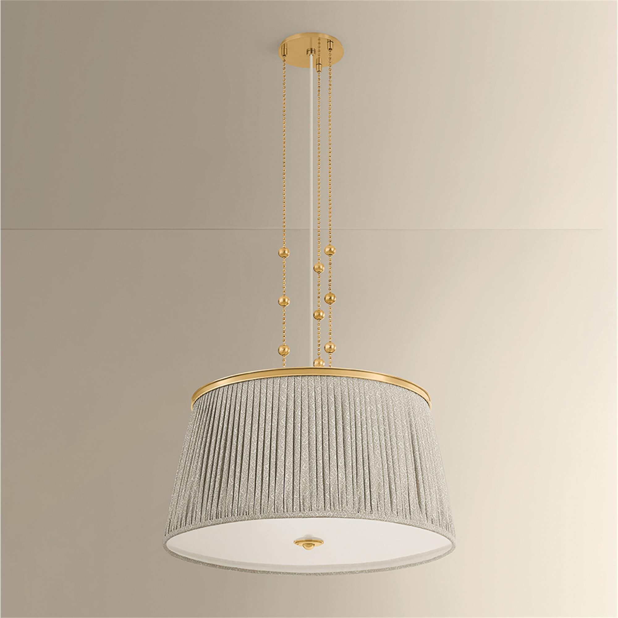 Shown in Aged Brass finish and Gathered Printed Cotton shade