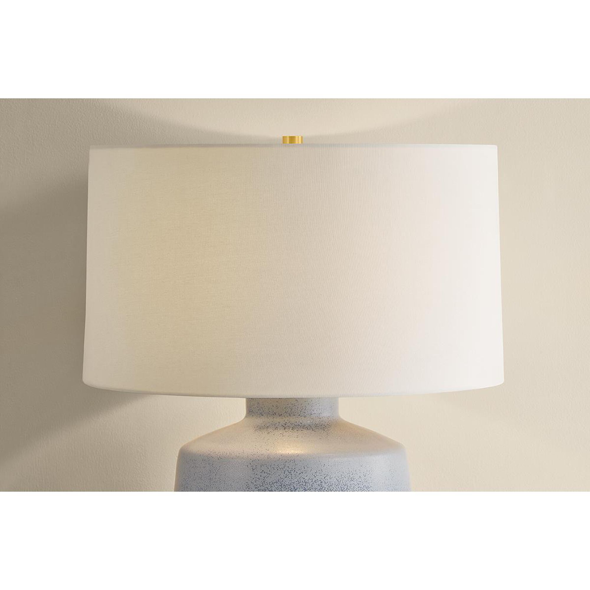 Shown in Aged Brass and Ceramic Oceanside finish and White Linen shade