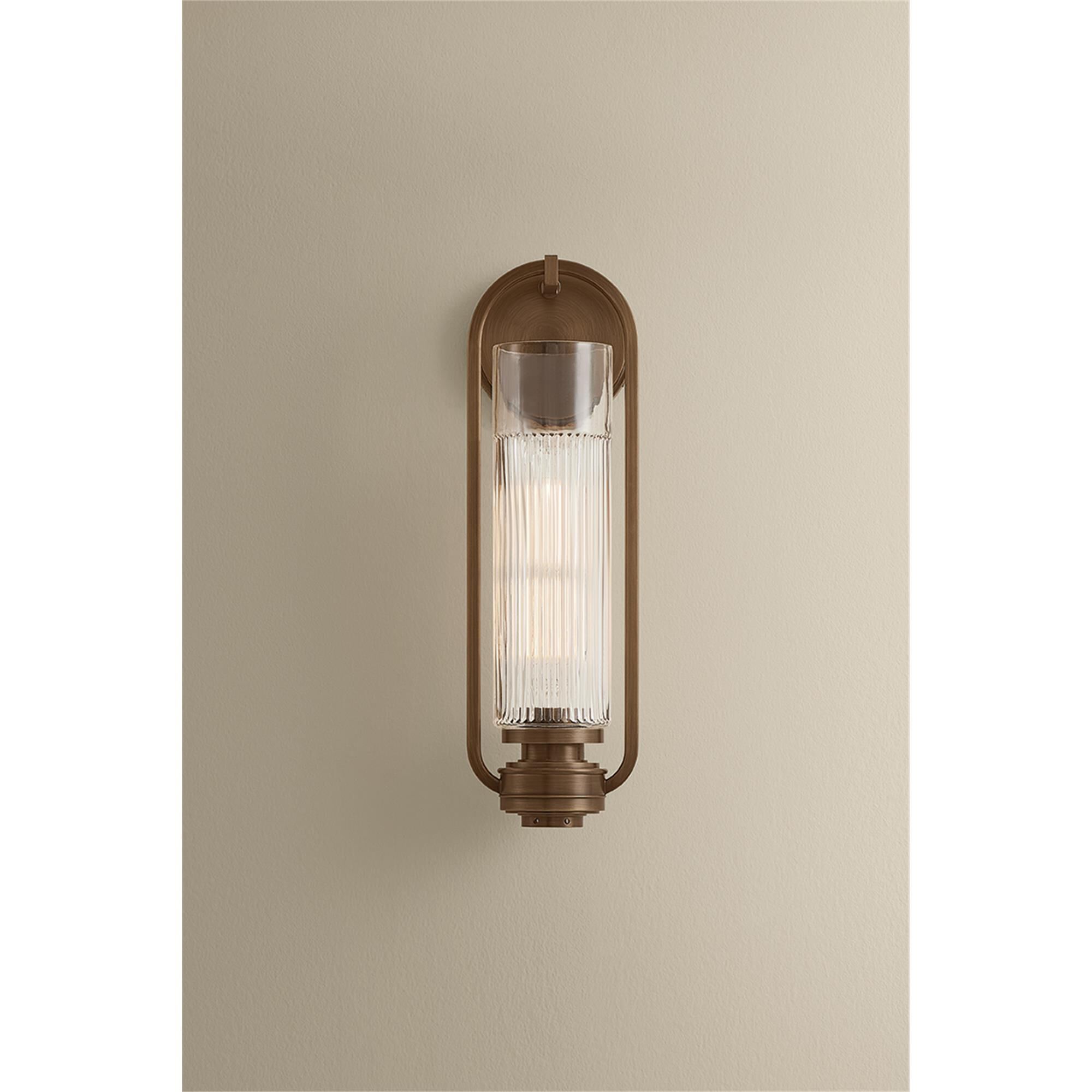 Shown in Aged Brass finish and Clear Optic glass