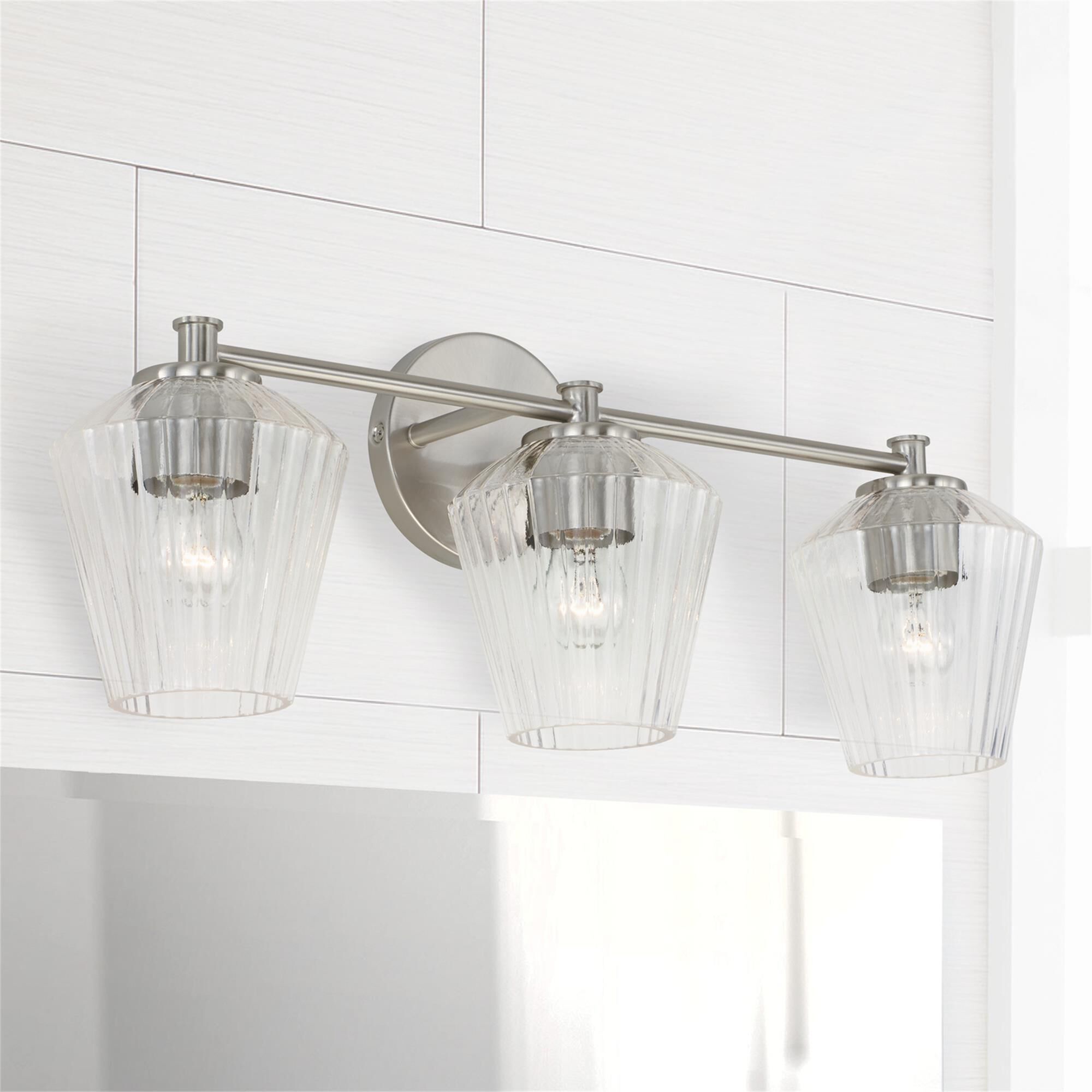 Shown in Brushed Nickel finish and Clear Fluted glass