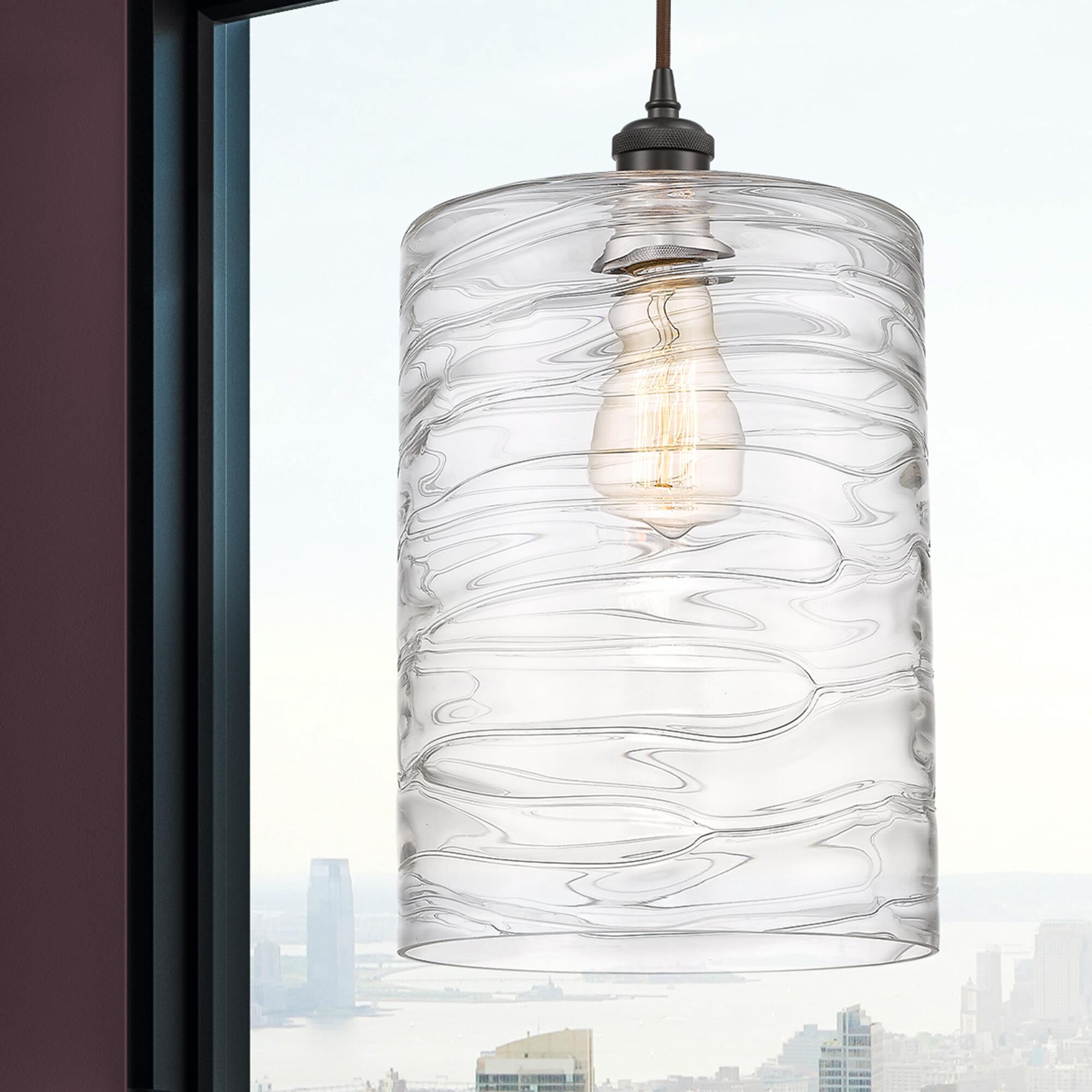 Shown in Oil Rubbed Bronze finish and Deco Swirl glass and Cord Hung accent