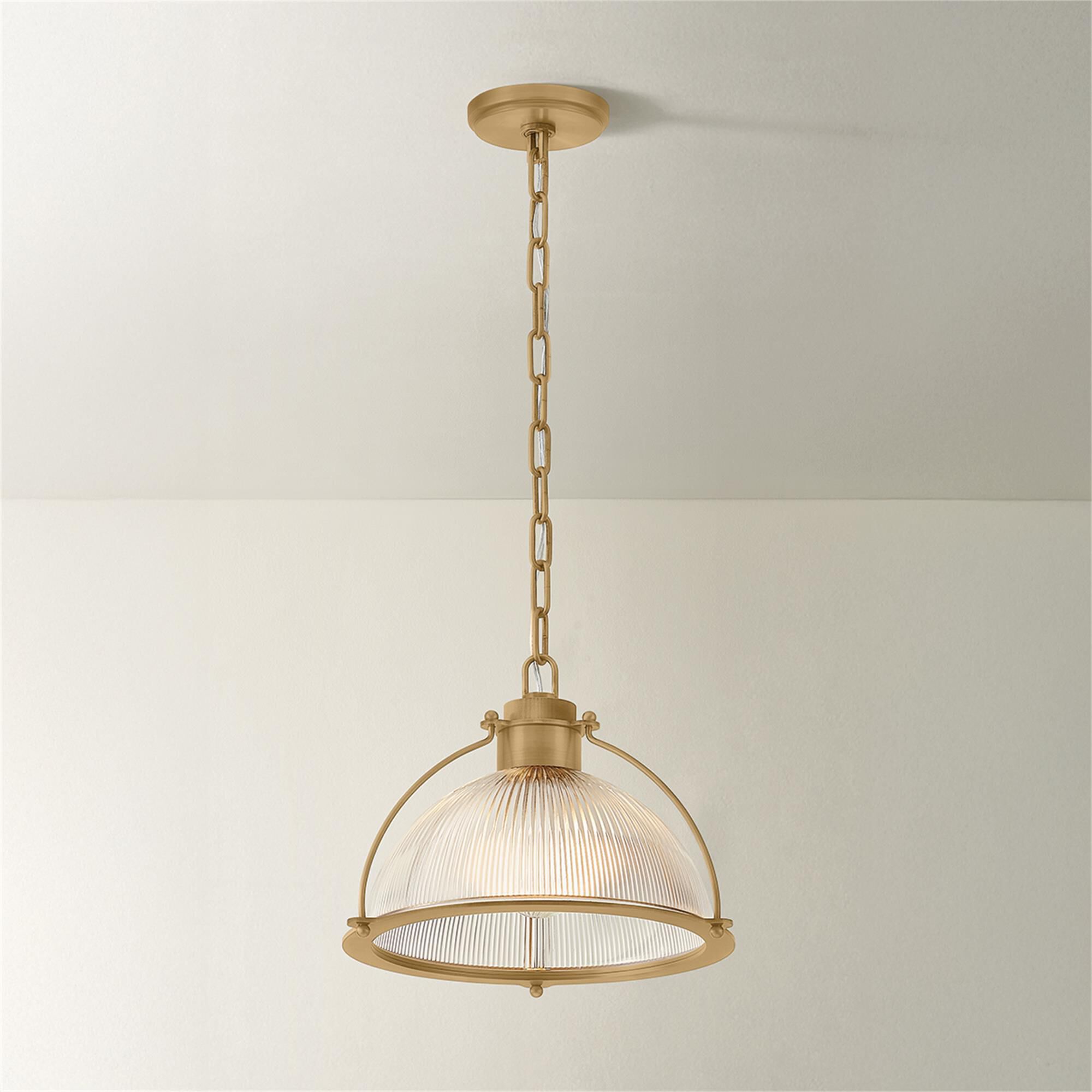 Shown in Patina Brass finish and Holophane glass