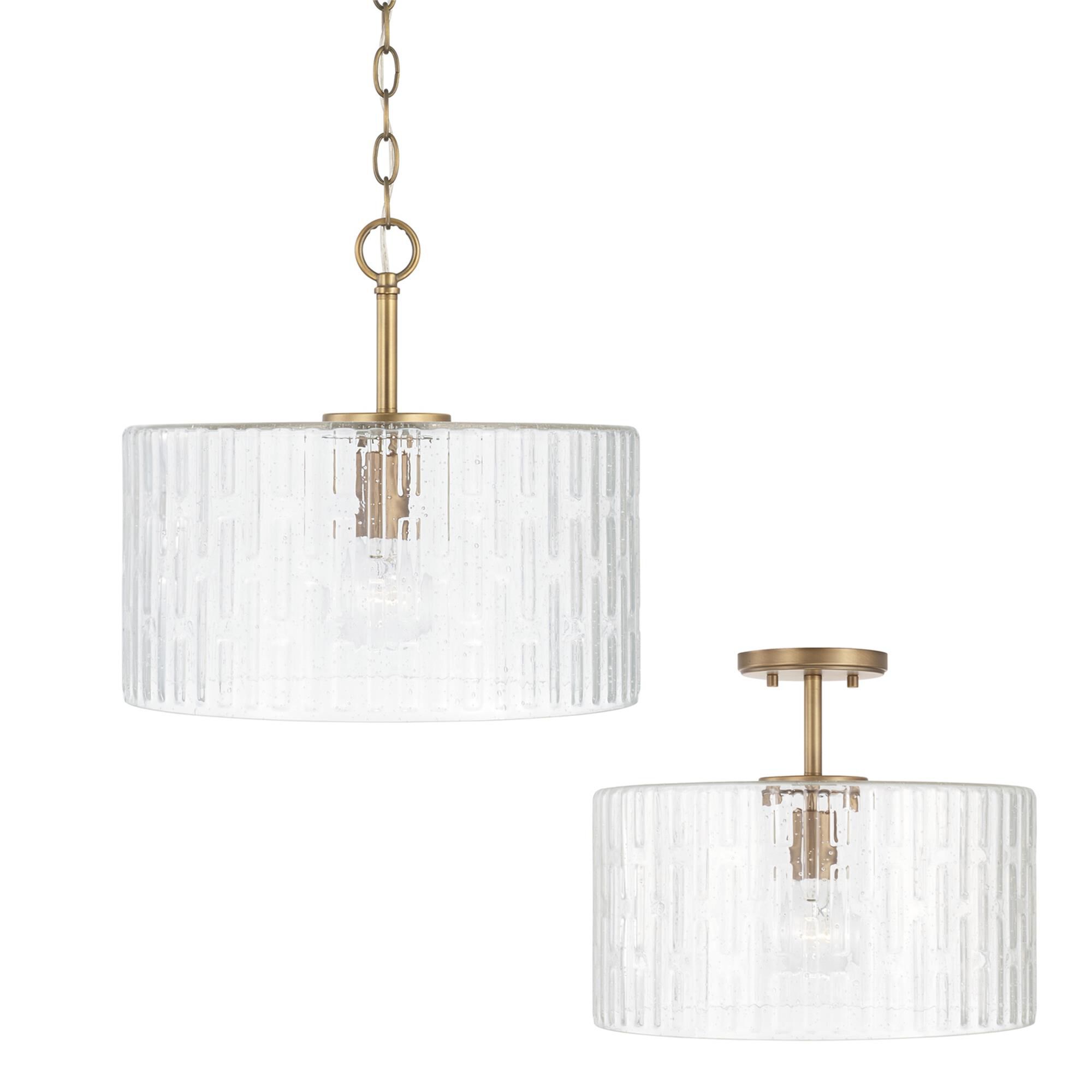 Shown in Aged Brass finish and Embossed Seeded glass