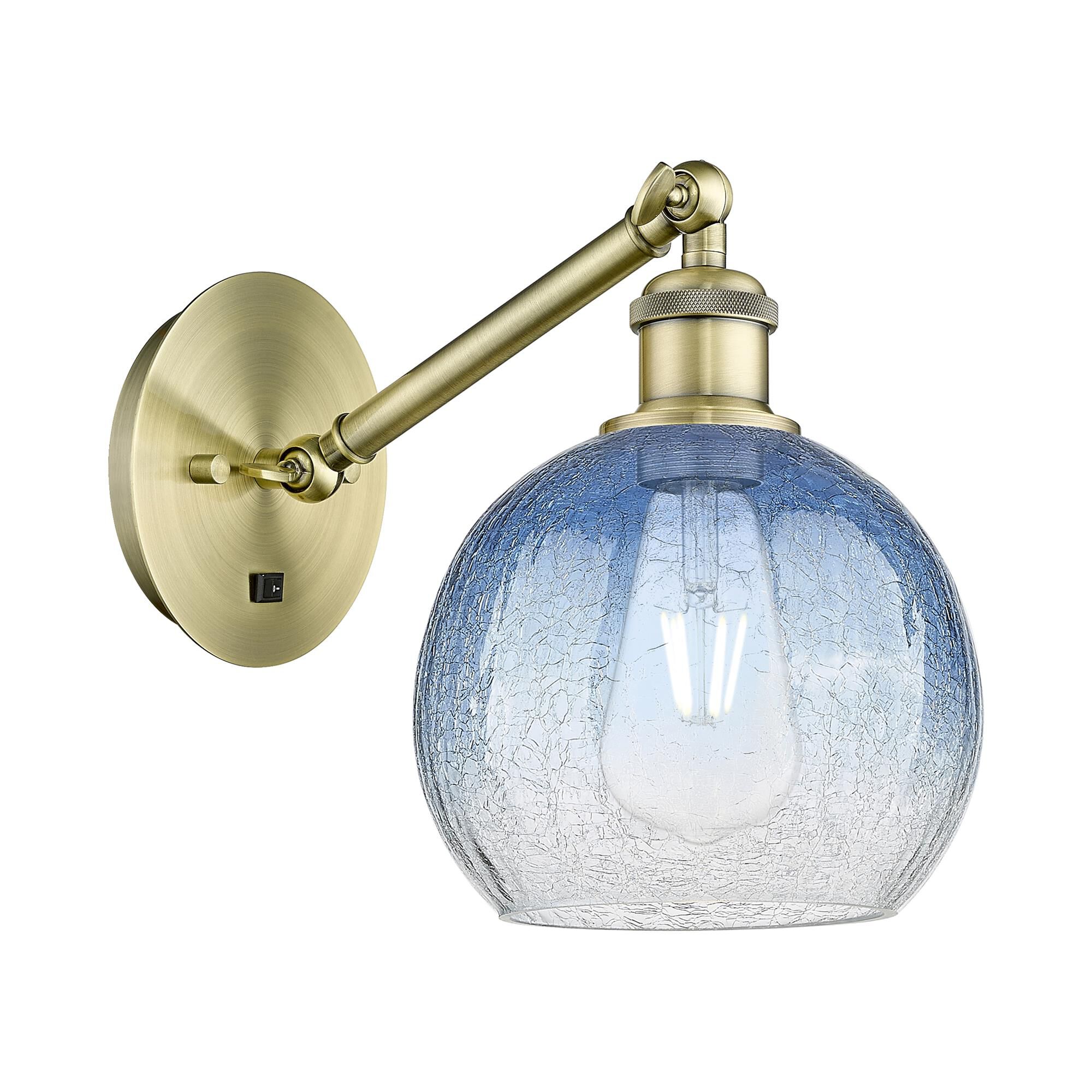Shown in Antique Brass finish and Sapphire Blue glass