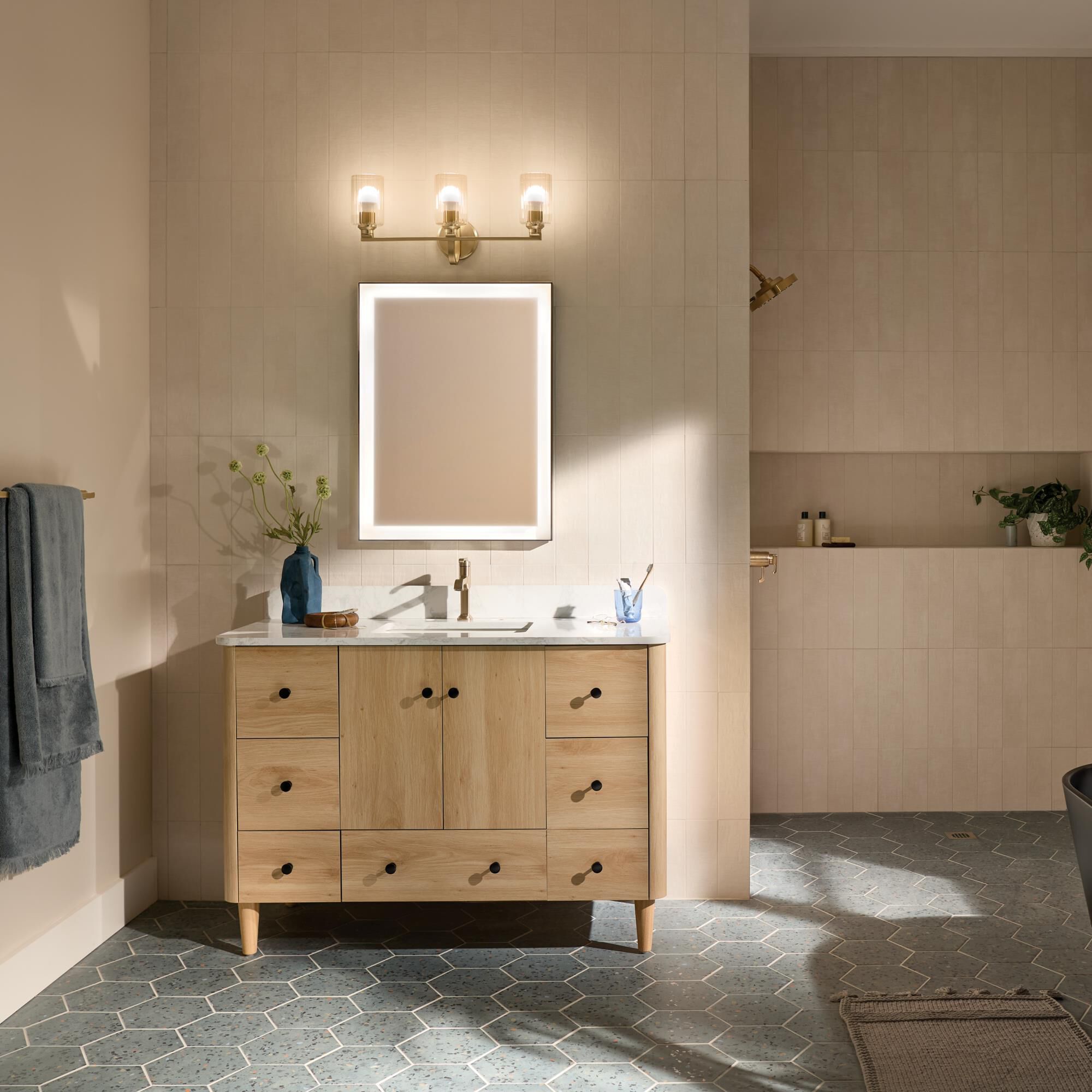 Shown in Champagne Bronze finish and Clear Fluted glass