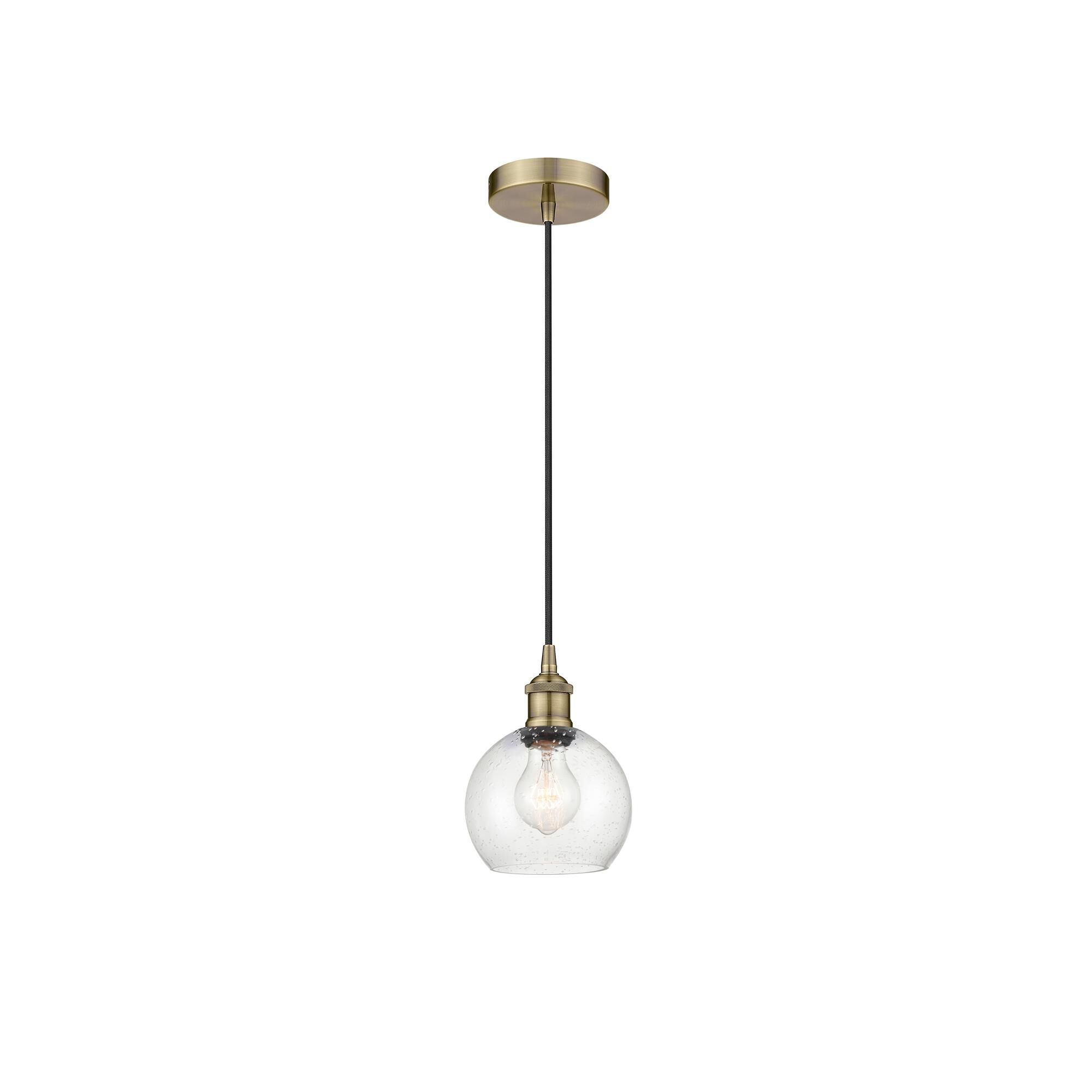 Shown in Antique Brass finish and Seedy Athens glass