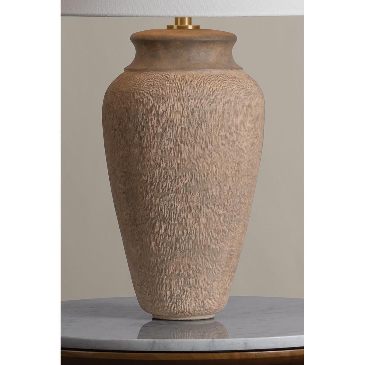 Shown in Patina Brass and Ceramic Textural Umber finish and Off White Linen shade