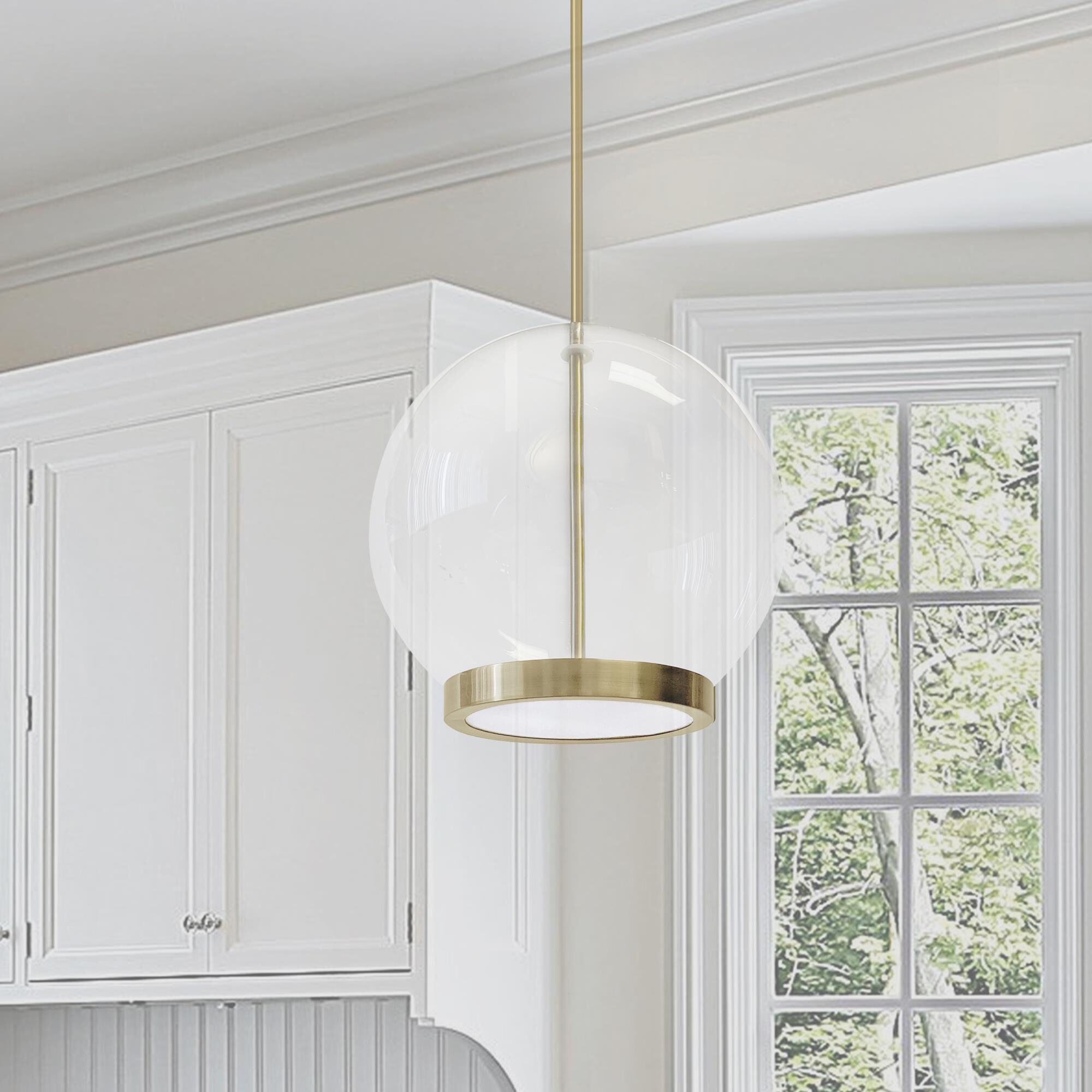 Shown in Clear and Aged Brass finish and Clear Globe glass