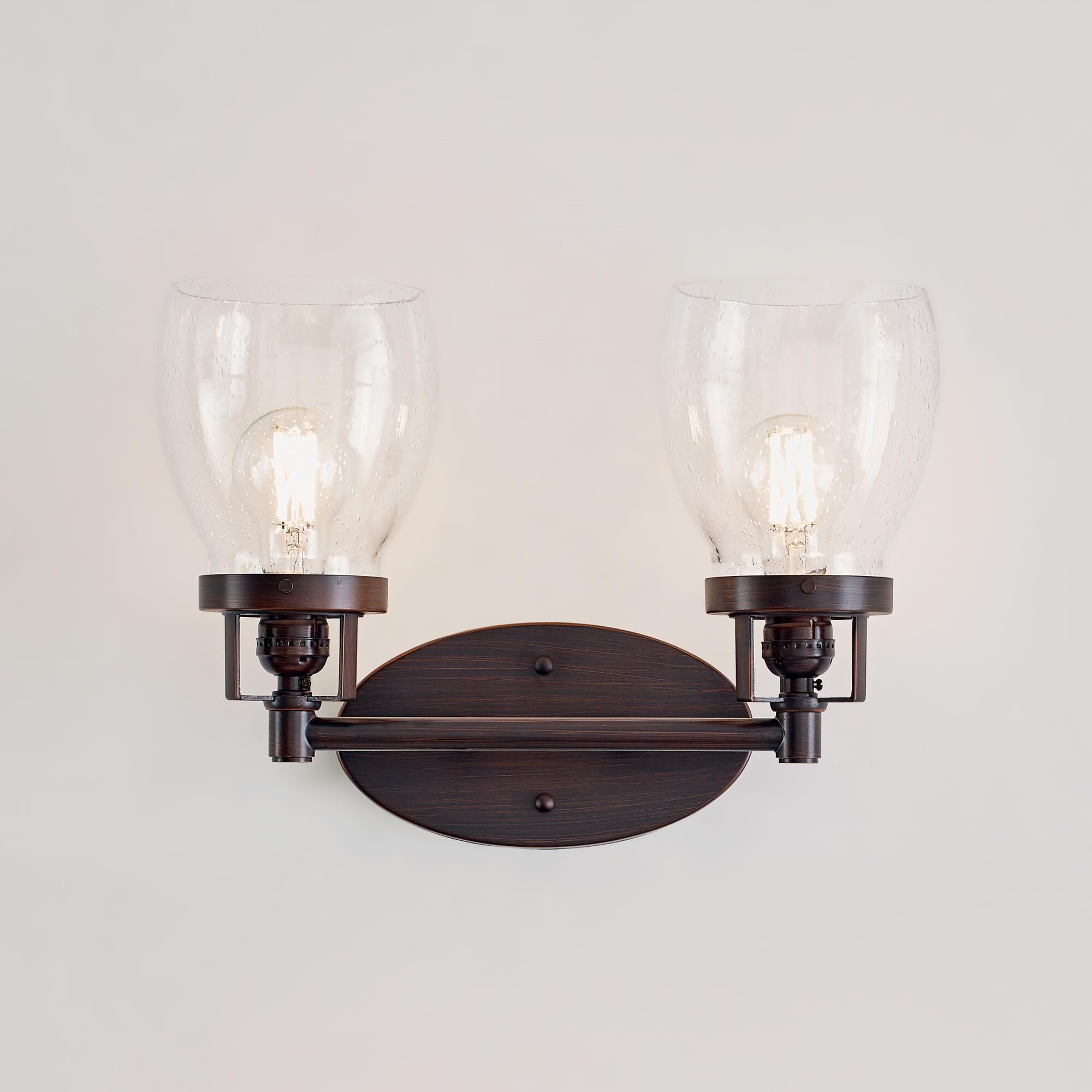 Shown in Bronze finish and Clear Seeded glass