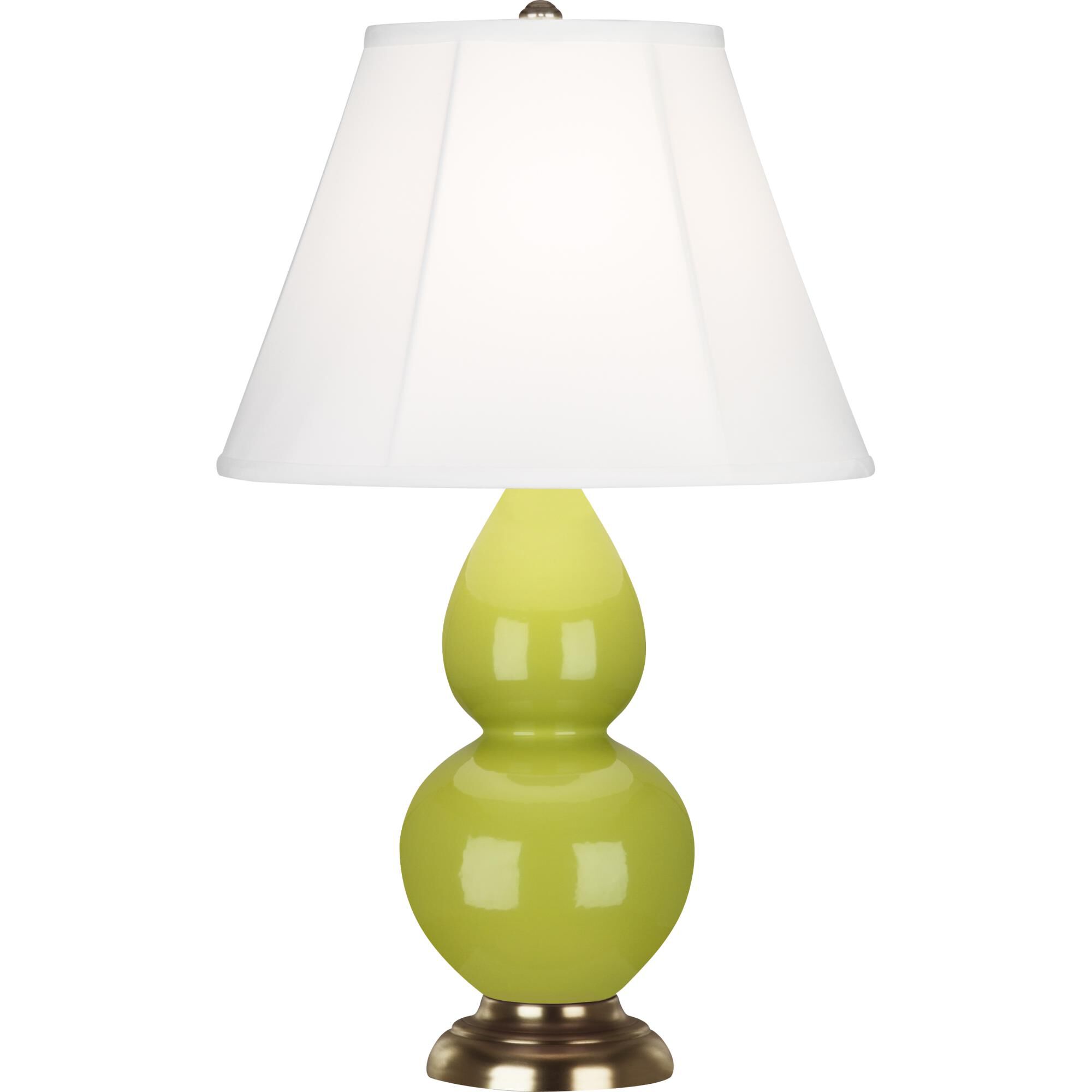 Shown in Apple Glazed Ceramic With Antique Natural Brass ed Accents finish and Ivory Silk Stretch shade