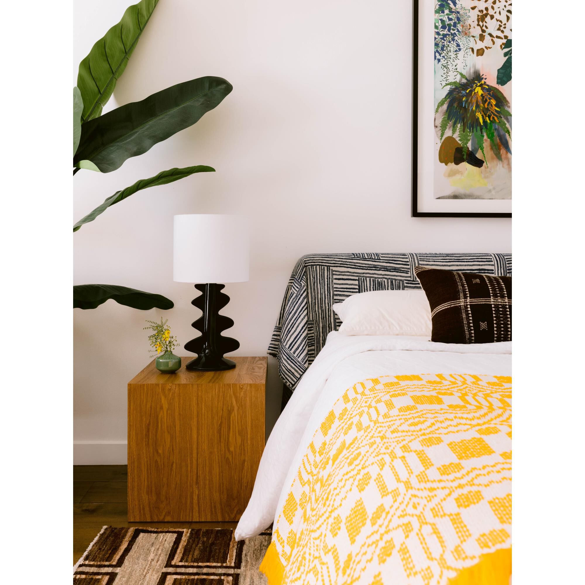 Shown in Aged Brass and Ceramic Gloss Black finish and White Linen shade