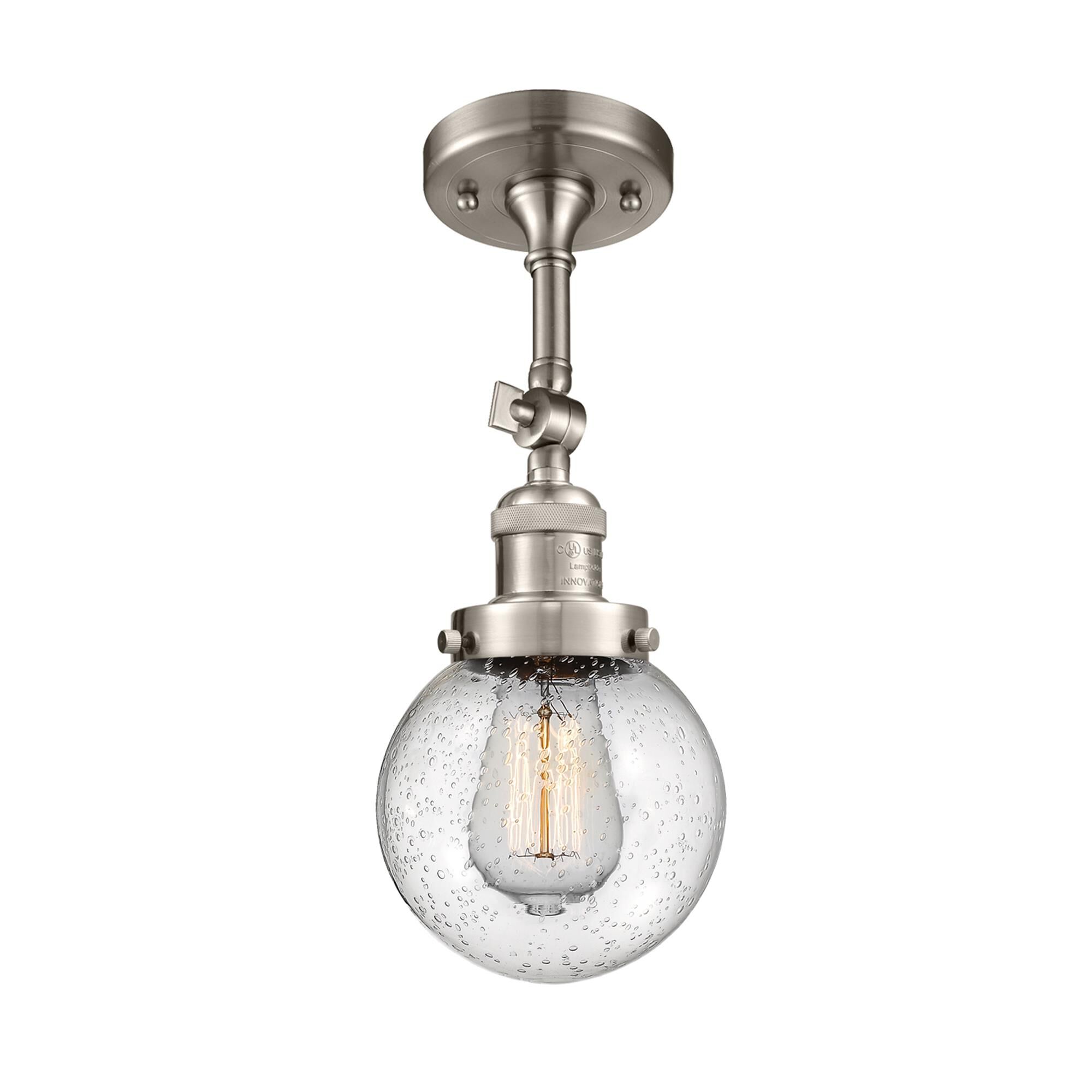 Shown in Brushed Satin Nickel finish and Seedy glass and No Accent accent