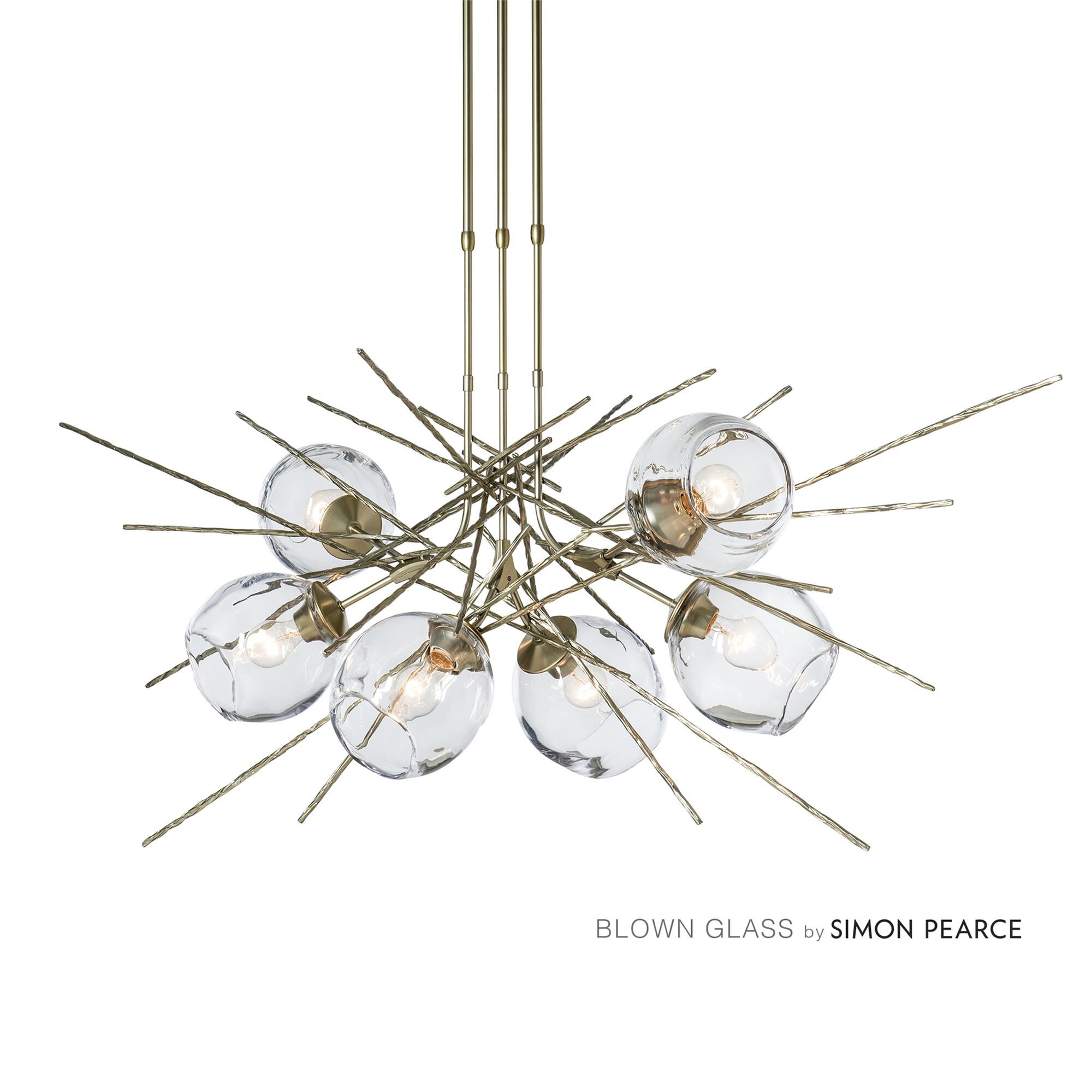 Shown in Modern Brass finish and Clear shade