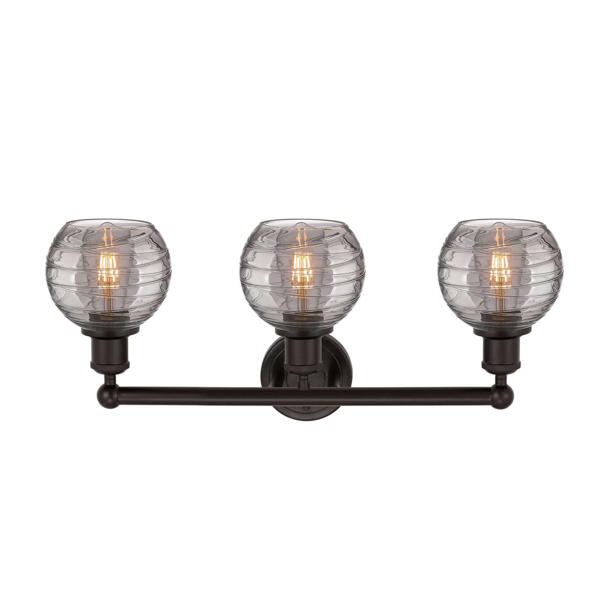Shown in Oil Rubbed Bronze finish and Light Smoke Deco Swirl glass