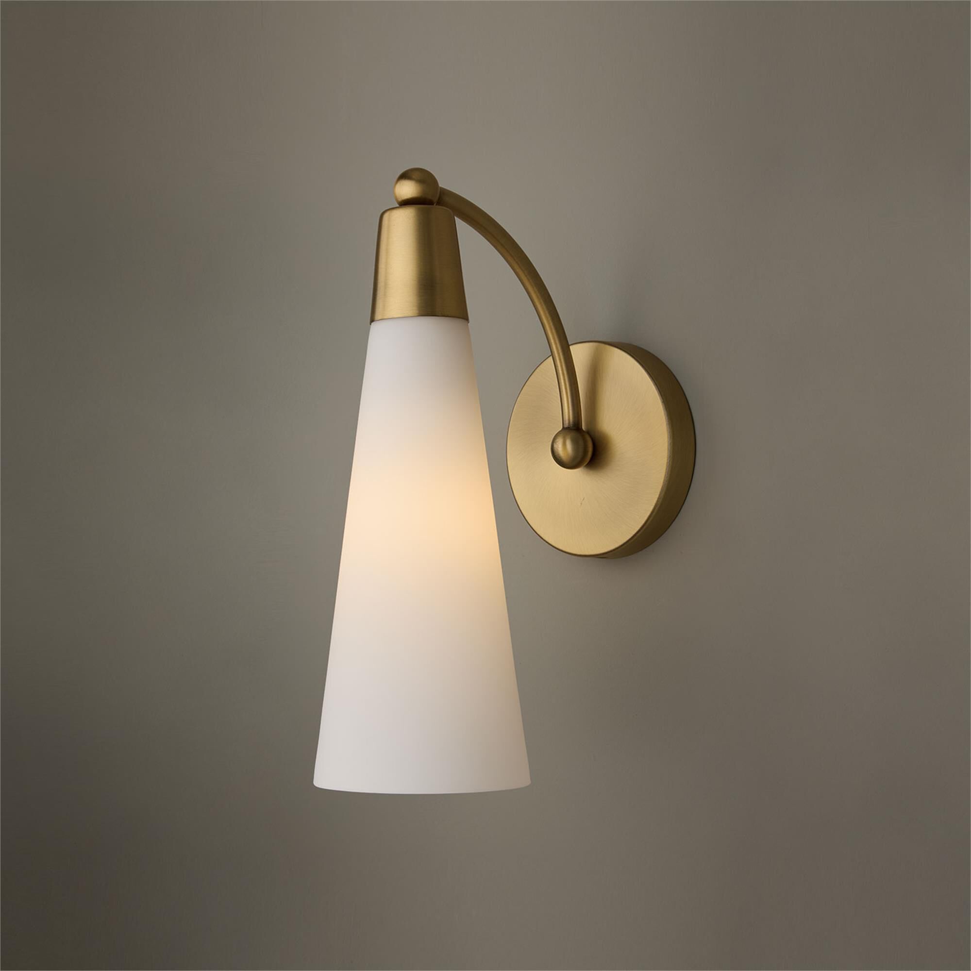 Shown in Aged Brass finish and Soft White glass
