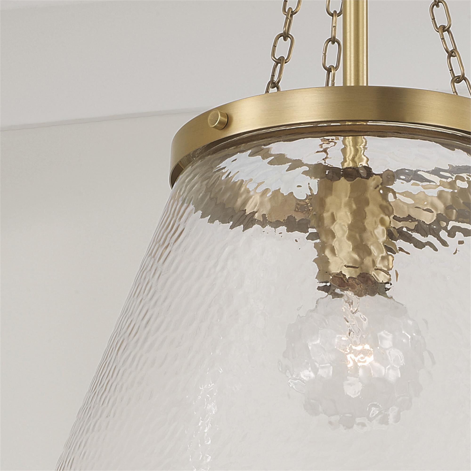 Shown in Aged Brass finish and Organic Hammered glass