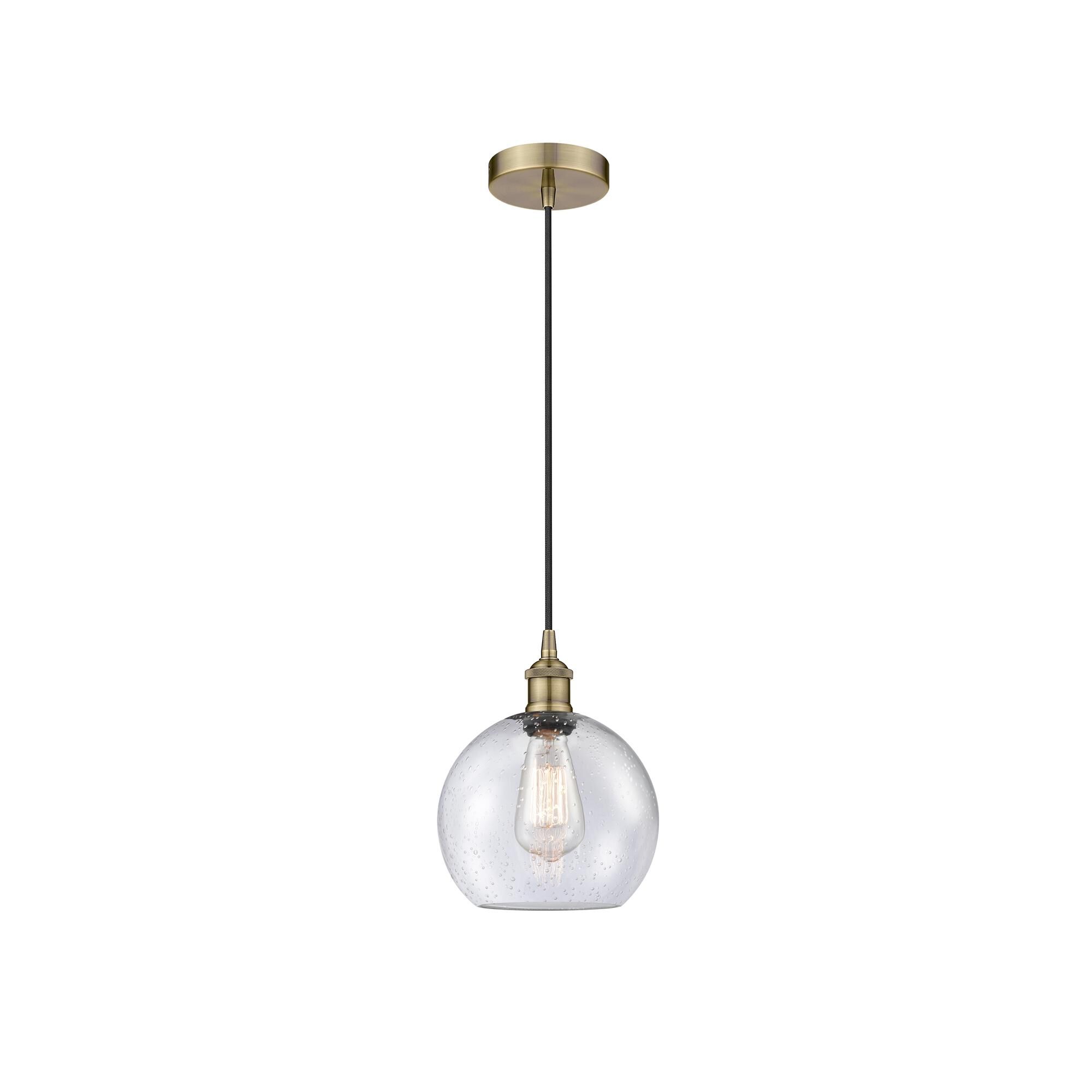 Shown in Antique Brass finish and Seedy glass