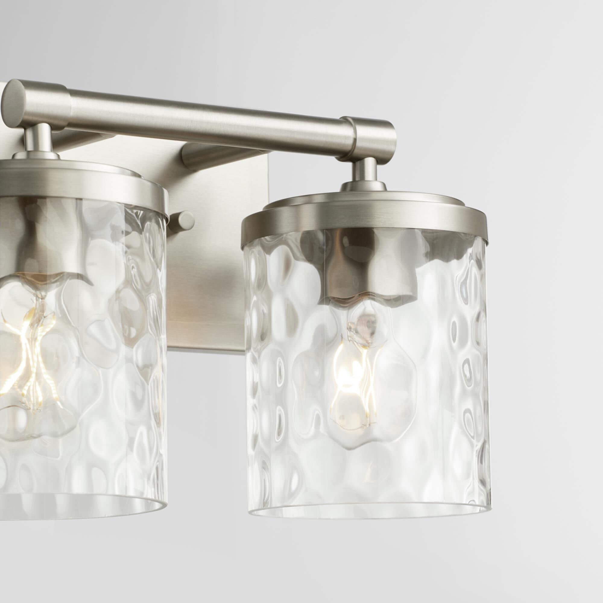 Shown in Satin Nickel finish and Clear Hammered glass