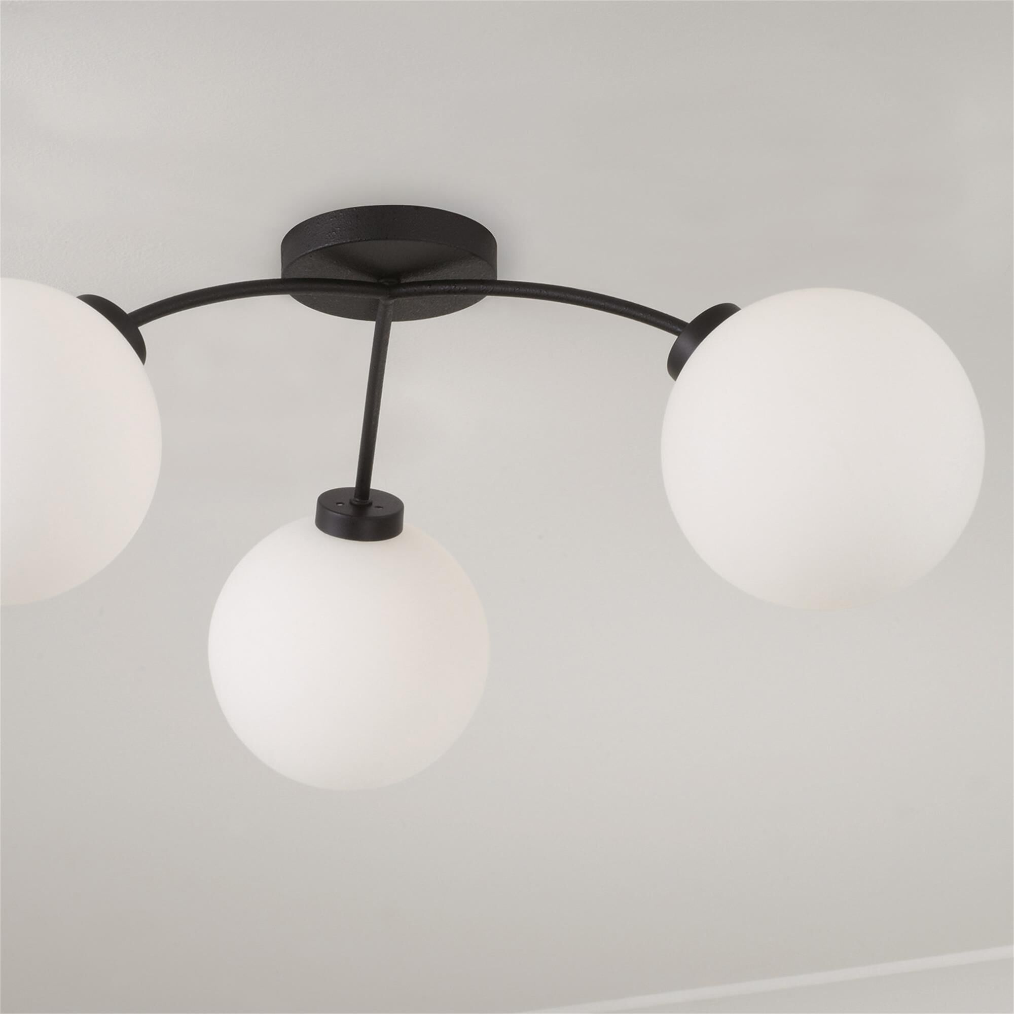 Shown in Black Iron finish and Soft White glass