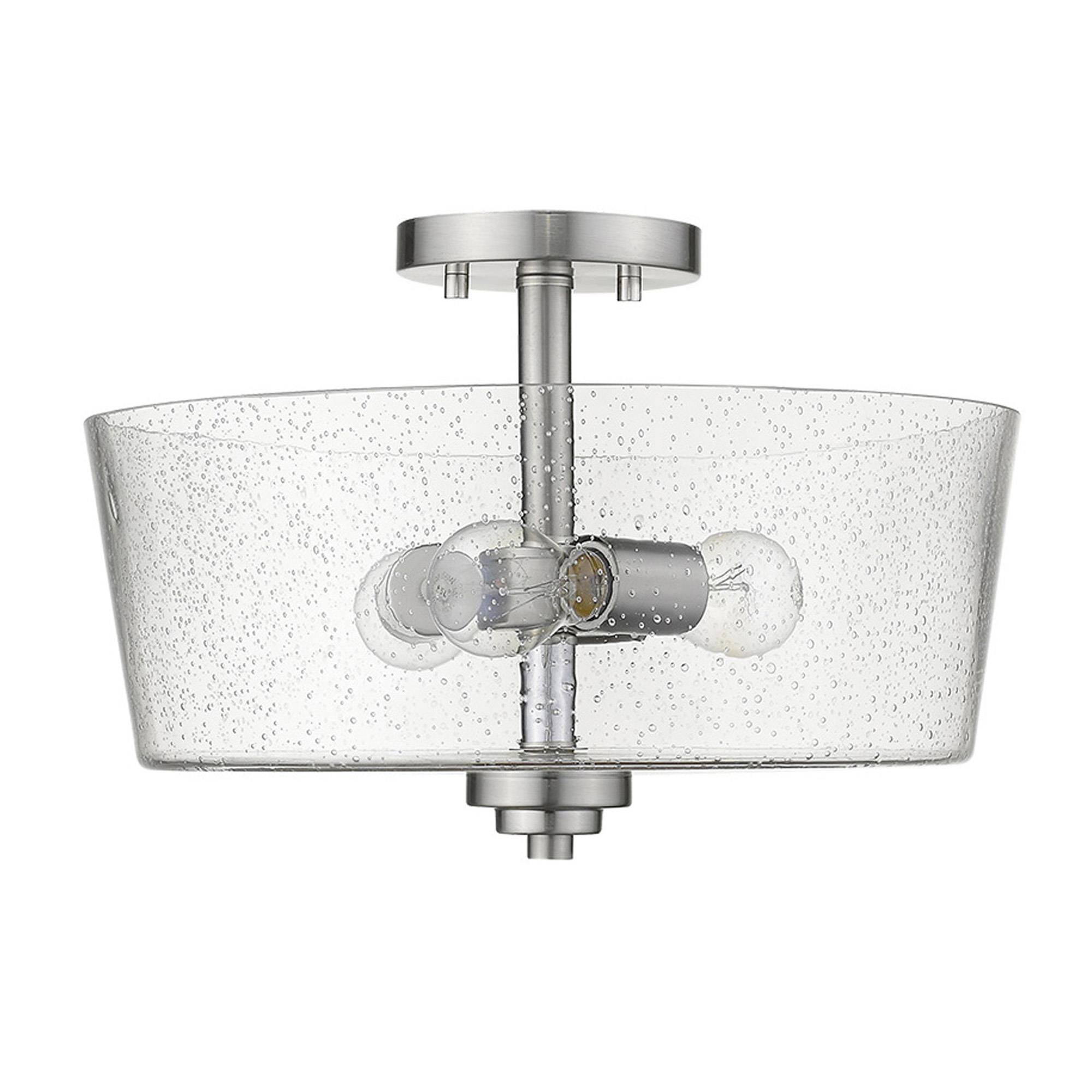 Shown in Satin Nickel finish and Clear glass and Clear, Seeded Drum Shaped Glass shade