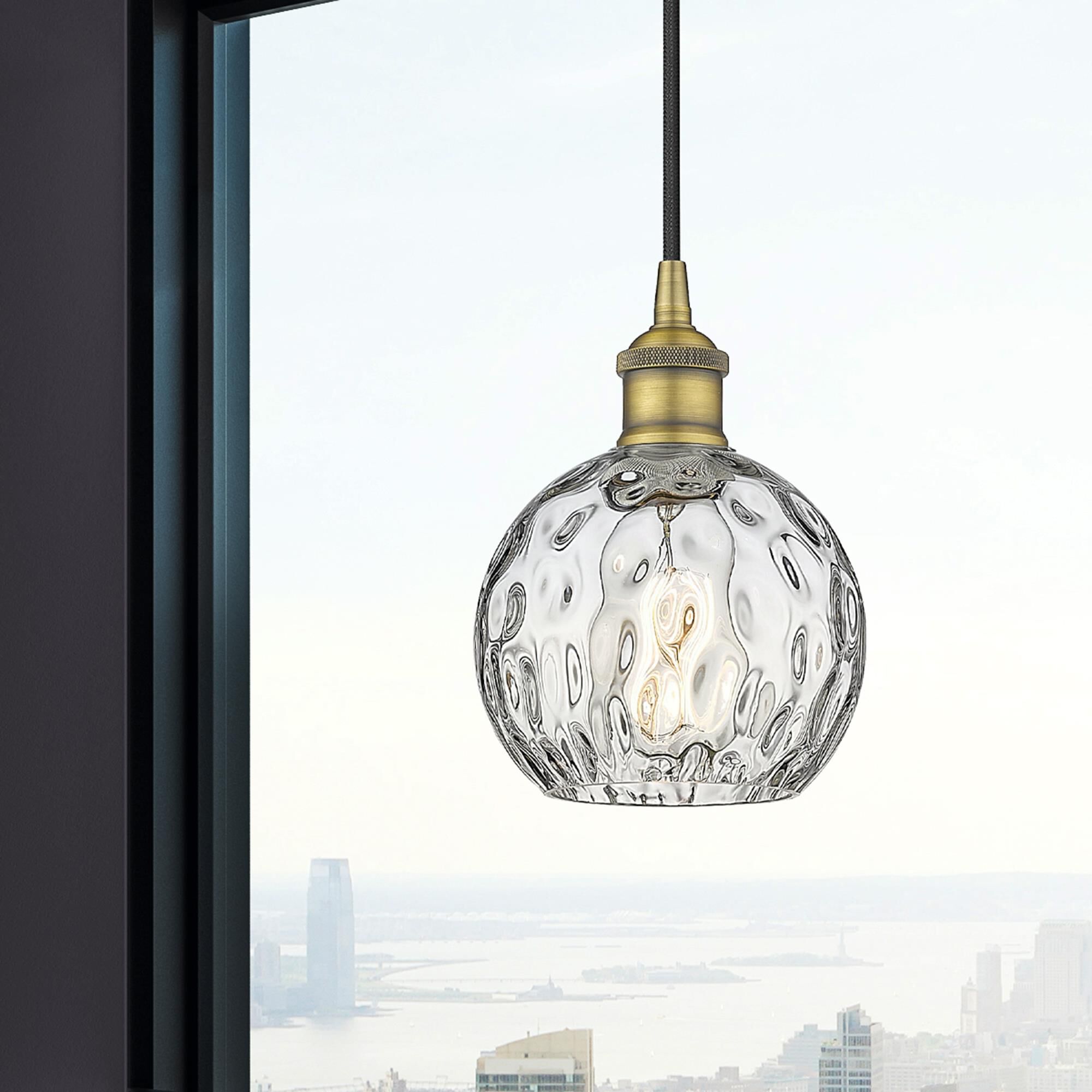 Shown in Brushed Brass finish and Clear glass