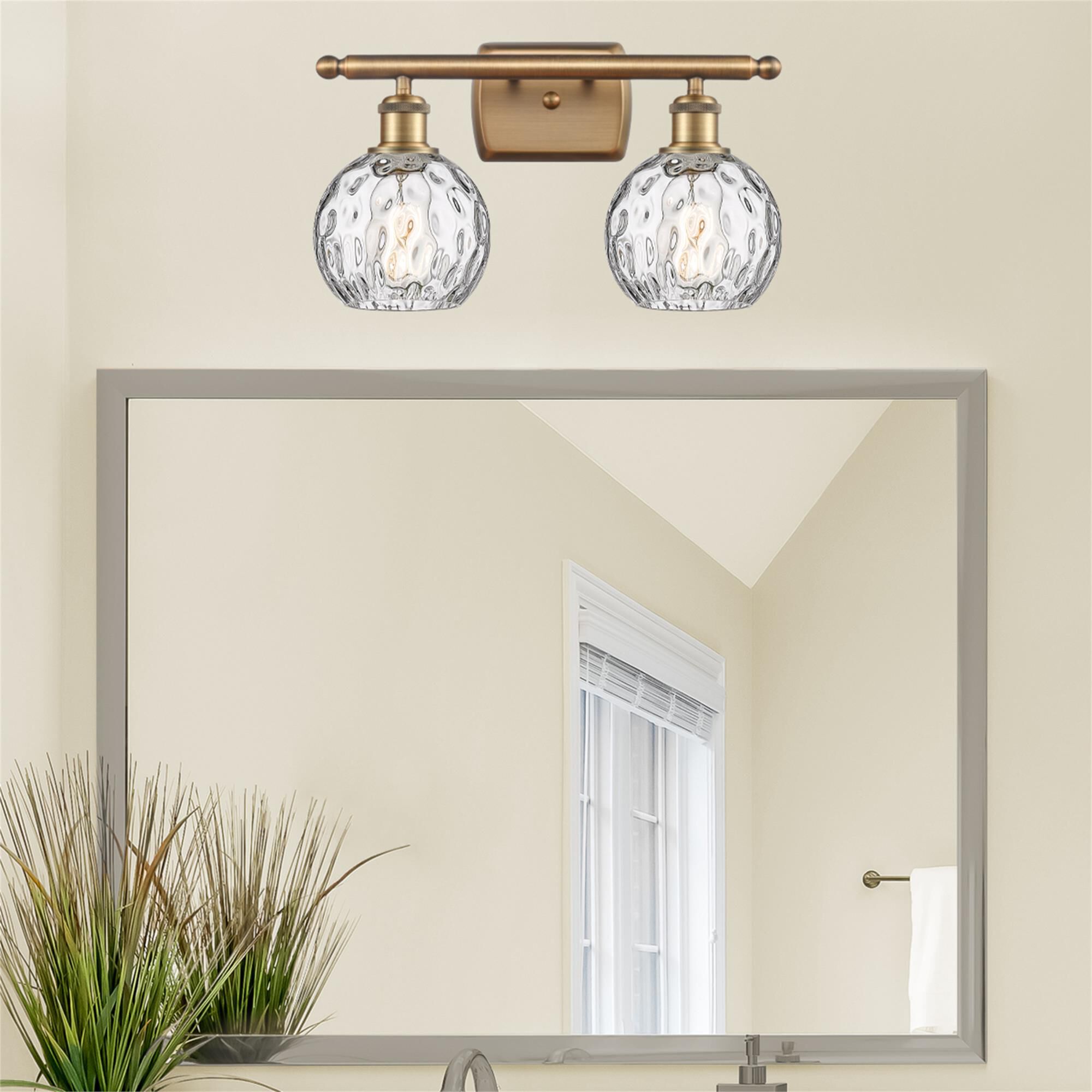 Shown in Brushed Brass finish and Clear glass
