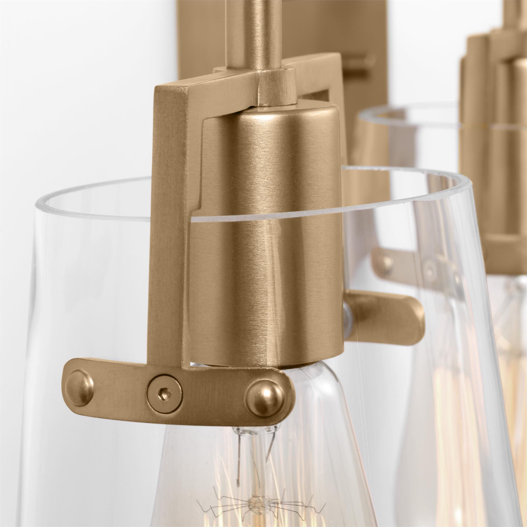 Shown in Satin Brass finish and Clear Glass s shade