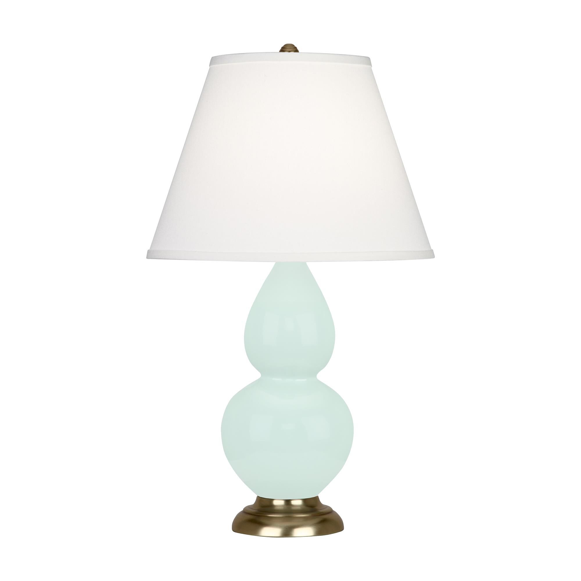 Shown in Mint Glazed finish and Pearl Dupioni shade and Antique Brass accent